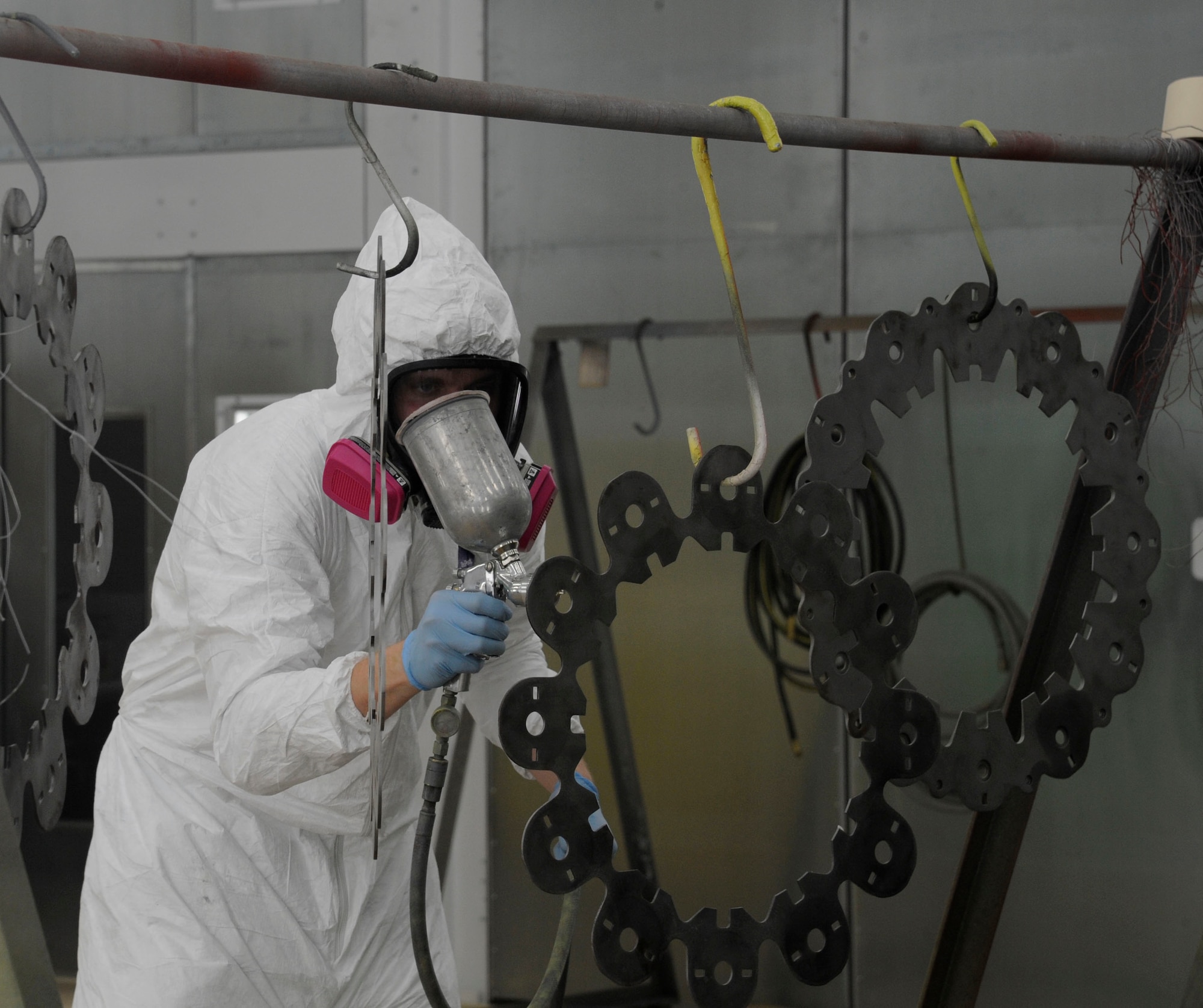 Airman 1st Class Wendell Brown, 2nd Maintenance Squadron fabrication flight, puts primer on B-52H Stratofortress brake components before adding the first coat of paint to them on Barksdale Air Force Base, La., May 29. Painting parts of the B-52H is just one responsibility of the sheet metal Airmen. Other responsibilities include making repairs and checking for corrosion. (U.S. Air Force photo/Airman 1st Class Andrew Moua)(RELEASED)
