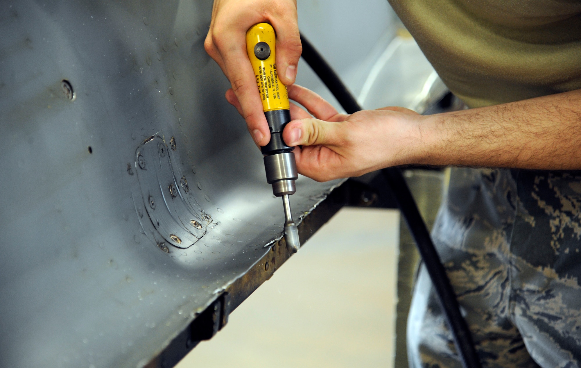 Airman 1st Class David Schlott, 2nd Maintenance Squadron fabrication flight, sands down a B-52H Stratofortress engine cowling on Barksdale Air Force Base, La., May 29. With maintenance, painting and building parts needed for a B-52H, the fabrication flight ensures that Barksdale's B-52Hs are ready to complete missions worldwide. (U.S. Air Force photo/Airman 1st Class Andrew Moua)(RELEASED)
