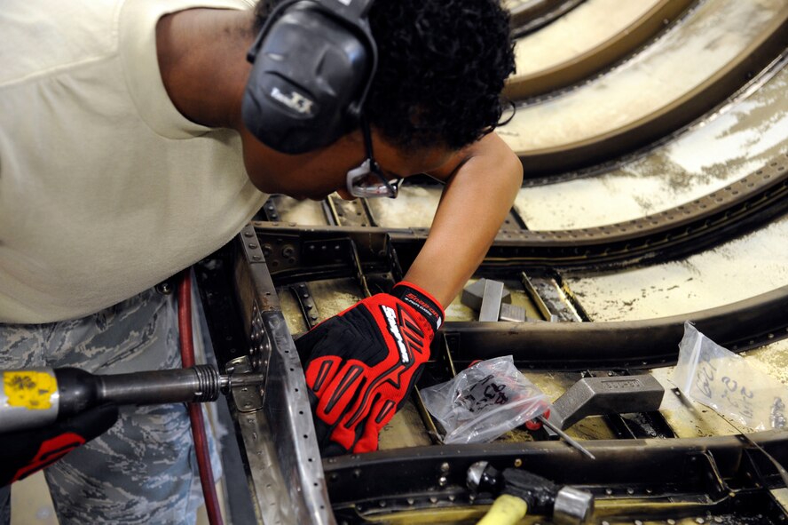 Airman 1st Class Diamond Robinson, 2nd Maintenance Squadron fabrication flight, repairs a B-52H Stratofortress engine cowling on Barksdale Air Force Base, La., May 29. Robinson replaced old rivets to ensure Barksdale's B-52Hs remain ready to fly at a moment's notice. (U.S. Air Force photo/Airman 1st Class Andrew Moua)(RELEASED)
