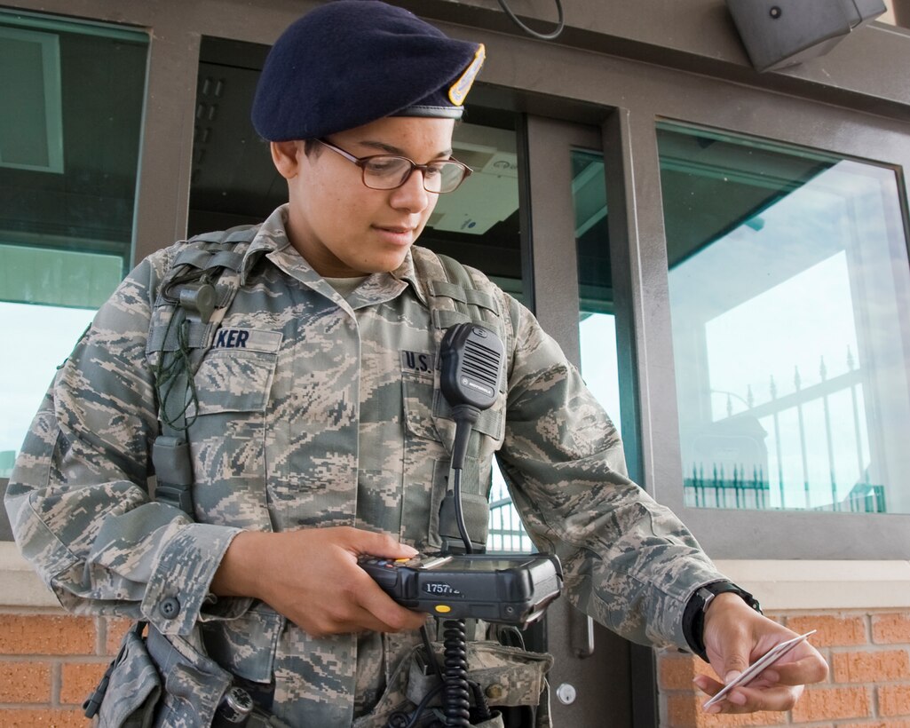 Airman 1st Class Patience Walker, 82nd Security Forces Squadron, scans an identification card with a Defense Biometric Identification System (DBIDS) system at Sheppard Air Force Base May 22, 2012. Starting Jun 1, card holders will no longer be required to go to the Sheppard Air Force Base visitor’s center to register their cards in the DBIDS system. (U.S. Air Force photo/Frank H. Carter)
