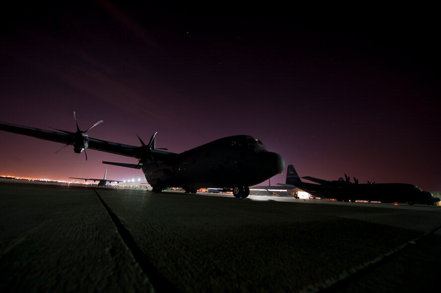 A C-130J from the 317th Airlift Group sits on the Nellis Air Force Base, Nev. flight line May 23, 2012 after supporting the U.S. Air Force Weapons School Mobility Forces Exercise. The mass air mobility exercise, in which nearly 70 aircraft primarily consisting of C-17 Globemaster III and C-130 aircraft, practiced a "forced entry" operation. In the scenario, U.S. forces entered a simulated defended enemy country, defeated defending air defense forces and put troops on the ground. (U.S. Air Force photo by Airman 1st Class Damon Kasberg /Released)