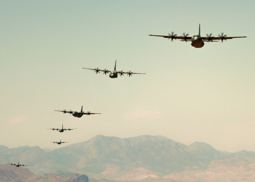 C-130Js from across the Air Force fly over the Nevada Test and Training Range May 23, 2012 during the U.S. Air Force Weapons School Moblilty Forces Exercise. The mass air mobility exercise, in which nearly 70 aircraft primarily consisting of C-17 Globemaster III and C-130 aircraft, practiced a "forced entry" operation. In the scenario, U.S. forces entered a simulated defended enemy country, defeated defending air defense forces and put troops on the ground. (U.S. Air Force photo by Airman 1st Class Damon Kasberg /Released)