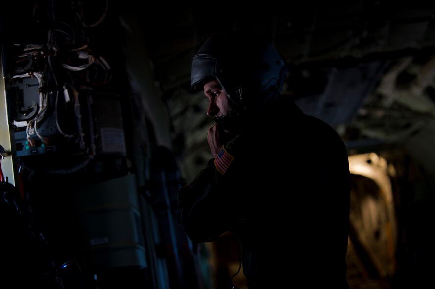 Airman 1st Class Rocky Menard, 40th Airlift Squadron, prepares his gear prior to a C-130J reaching the Nevada Test and Training Range May 23, 2012, during the U.S. Air Force Weapons School Mobility Forces Exercise. The mass air mobility exercise, in which nearly 70 aircraft primarily consisting of C-17 Globemaster III and C-130 aircraft, practiced a "forced entry" operation. In the scenario, U.S. forces entered a simulated defended enemy country, defeated defending air defense forces and put troops on the ground. (U.S. Air Force photo by Airman 1st Class Damon Kasberg /Released)