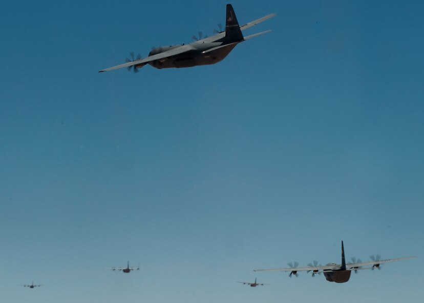 C-130Js from across the U.S. Air Force fly toward the Nevada Test and Training Range May 23, 2012 to support the Mobility Forces Exercise, at Nellis Air Force Base, Nev. The mass air mobility exercise, in which nearly 70 aircraft primarily consisting of C-17 Globemaster III and C-130 aircraft, practiced a "forced entry" operation. In the scenario, U.S. forces entered a simulated defended enemy country, defeated defending air defense forces and put troops on the ground. (U.S. Air Force photo by Airman 1st Class Damon Kasberg /Released)