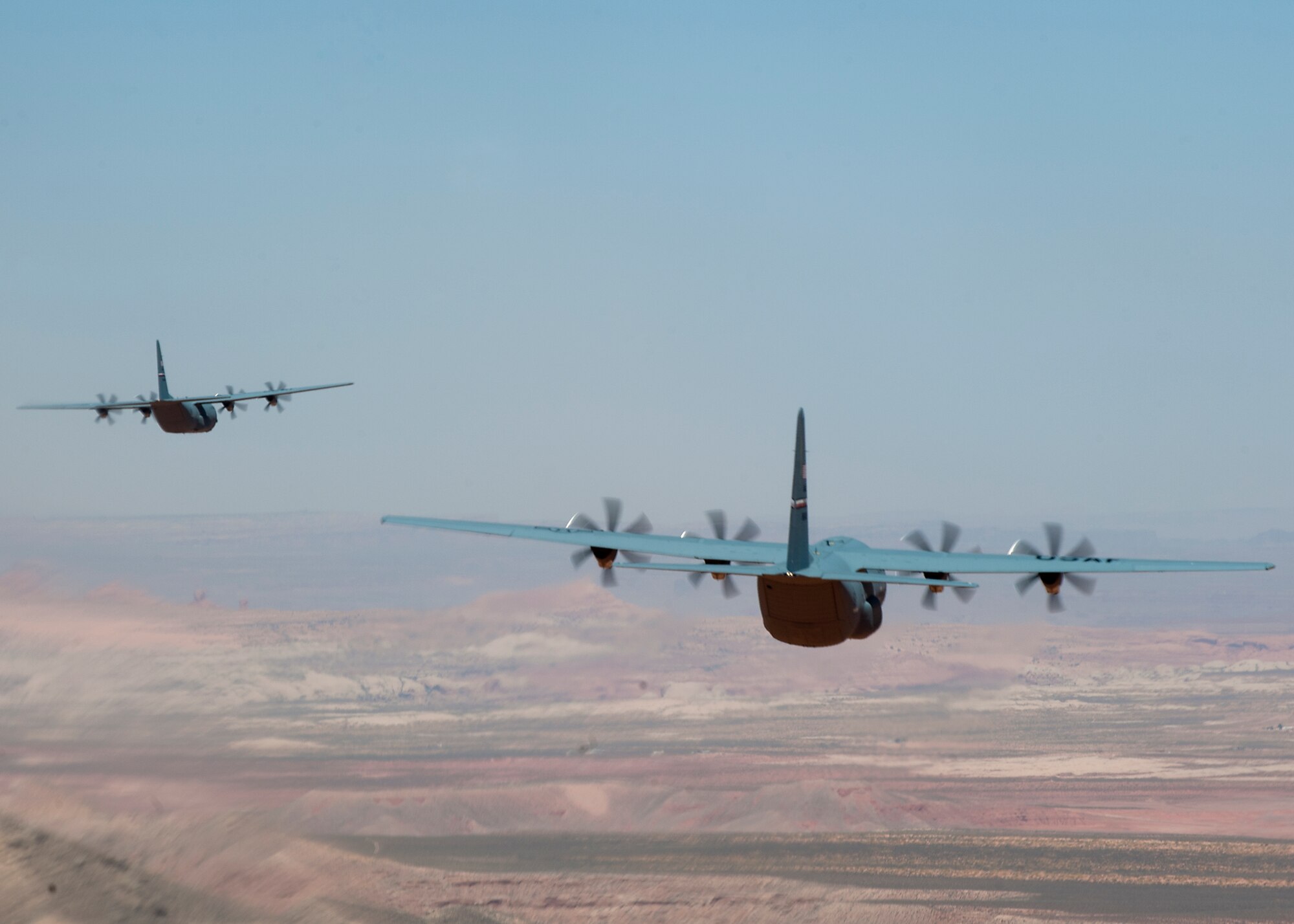 C-130Js from the 317th Airlift Group fly low level maneuvers as they head toward Nellis Air Force Base, Nev. May 21, 2012 to support the U.S. Air Force Weapons School’s Mobility Forces Exercise. The mass air mobility exercise, in which nearly 70 aircraft primarily consisting of C-17 Globemaster III and C-130 aircraft, practiced a "forced entry" operation. In the scenario, U.S. forces entered a simulated defended enemy country, defeated defending air defense forces and put troops on the ground. (U.S. Air Force photo by Airman 1st Class Damon Kasberg /Released)