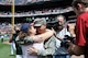 Master Sgt. David Sims embraces his wife, Robin, after surprising his family at the Atlanta Braves' Memorial Day game May 28, 2012, in Atlanta. Sims returned from a six-month deployment from Kabul, Afghanistan, May 27. Sims is assigned to Headquarters Air Force Reserve Command's Communications Directorate at Robins Air Force Base, Ga. (Defense Department photo/Jessica Blanton)