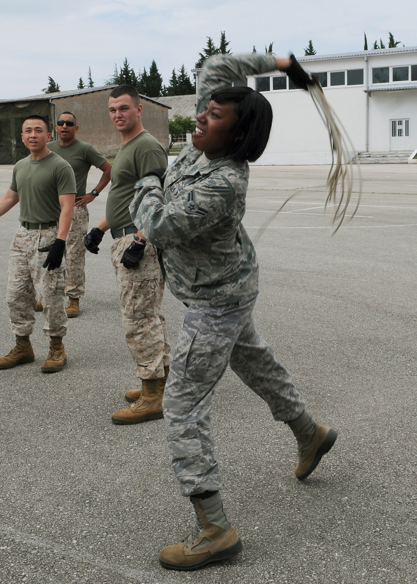 Airman 1st Class Courtney Peterson, a Washington, D.C., native from the 48th Inpatient Operations Squadron, RAF Lakenheath, England, throws a rope over an Alasken tent during the Expeditionary Medical Support course here, May 30, 2012. During the course, instructors from Joint Base San Antonio, Texas, taught more than 50 U.S. military members how to set up and operate a medical facility in a deployed environment. More than 500 military members from nine nations are participating in SR12, an annual U.S. Joint Chiefs of Staff sponsored exercise, May 28 - June 8. The goals of the exercise are to strengthen interoperability, facilitate training in crisis response and disaster management, and validate the readiness of deployable military medical and humanitarian assistance teams. The exercise, in the spirit of partnership for peace, directly supports U.S. European Command's theater cooperation efforts and strategy for active security with European countries.