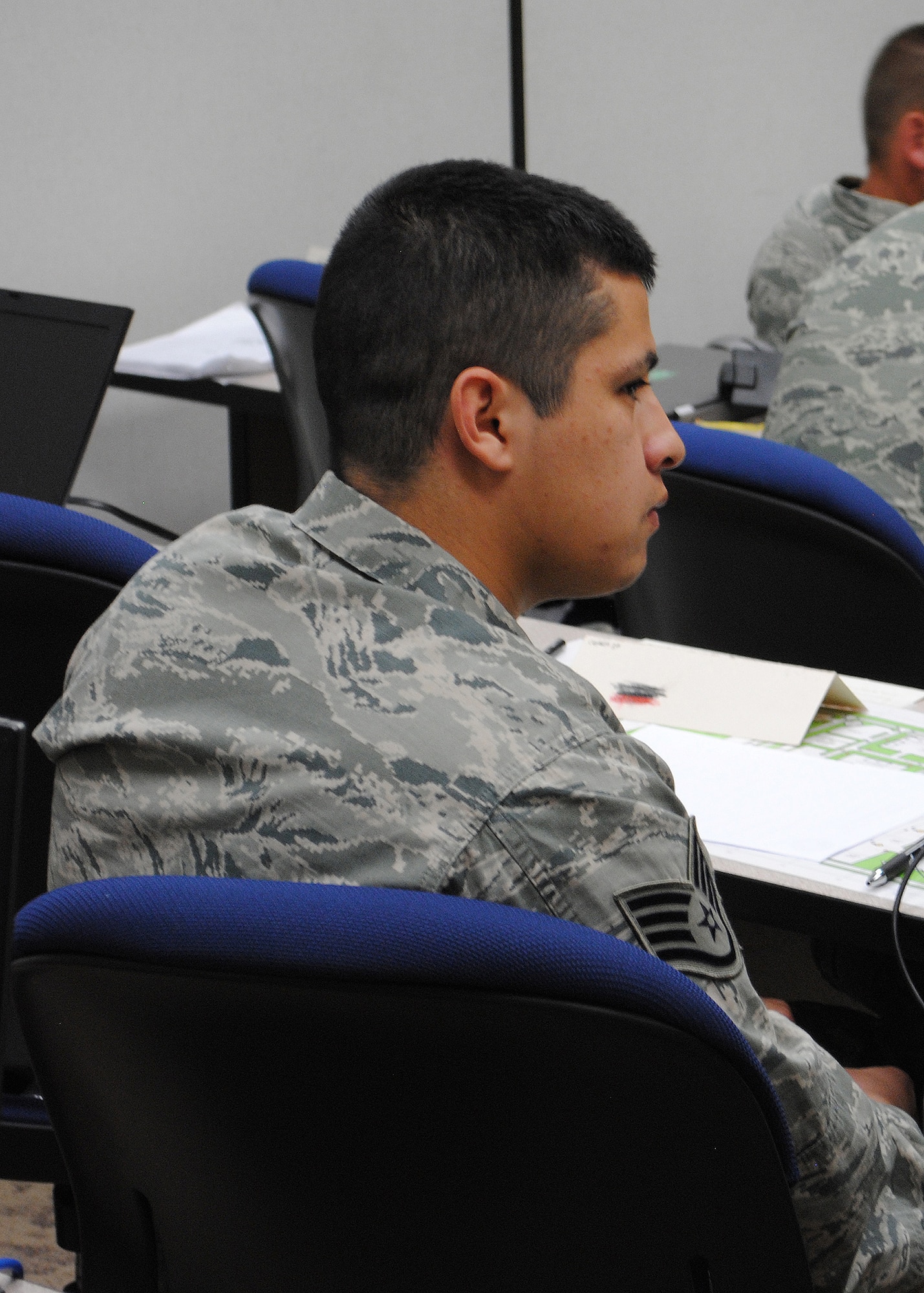 Staff Sgt. Robert Lysholm, 341st Civil Engineer Squadron fire protection crew chief, listens as one of the instructors briefs the class on fire safety. (U.S. Air Force photo/Airman 1st Class Cortney Paxton)