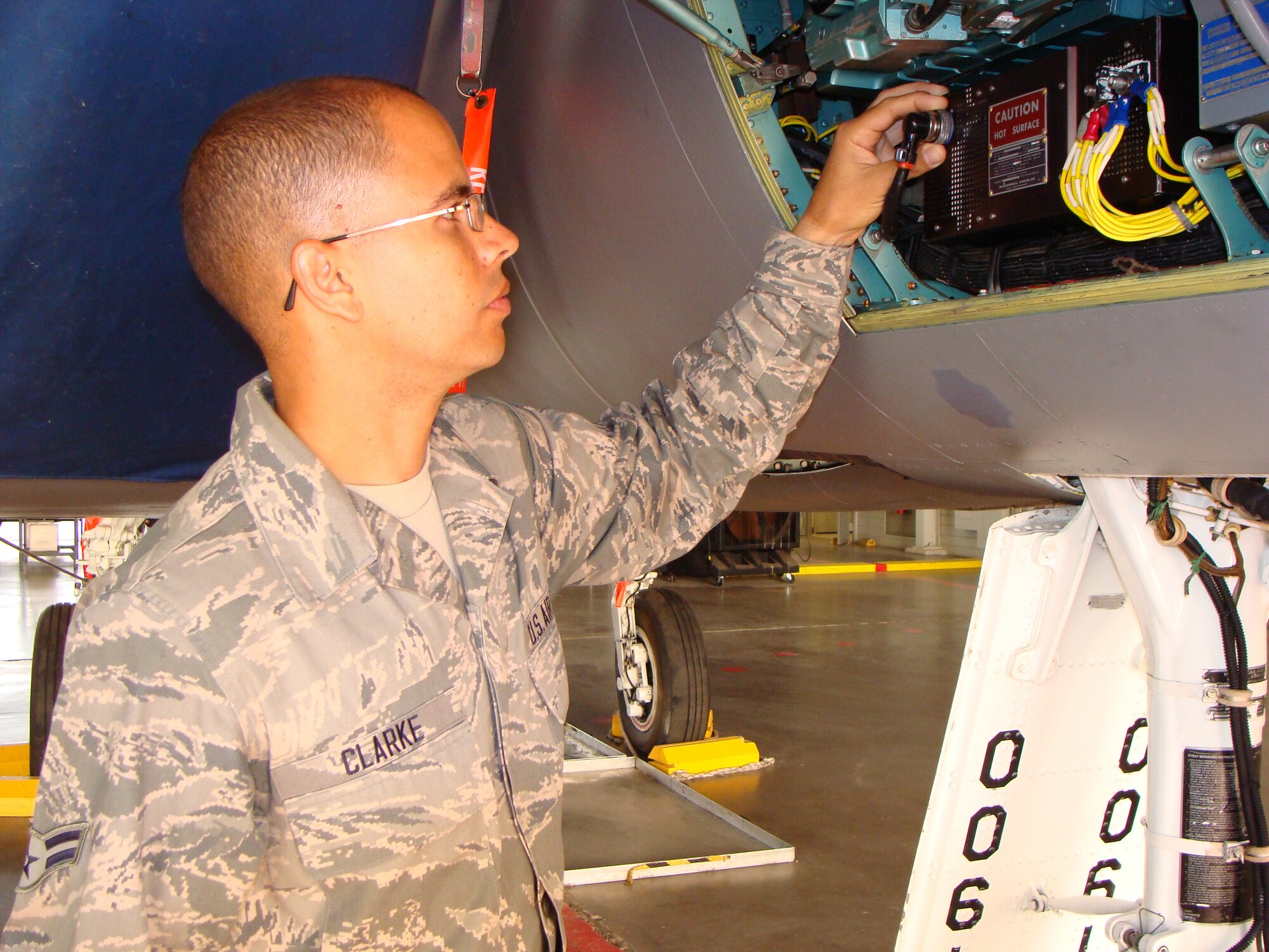 Airman 1st Class Darren Clarke inspects an F-16 electrical system during the 364th Training Squadron's Electrical and Environmental Systems apprentice course May 24, 2012 at Sheppard Air Force Base, Texas.  Clarke graduated the course Jun 1, 2012 with the ACE award, given to students who master the academic portion of the class with a 100 percent average. (U.S. Air Force courtesy photo) 
