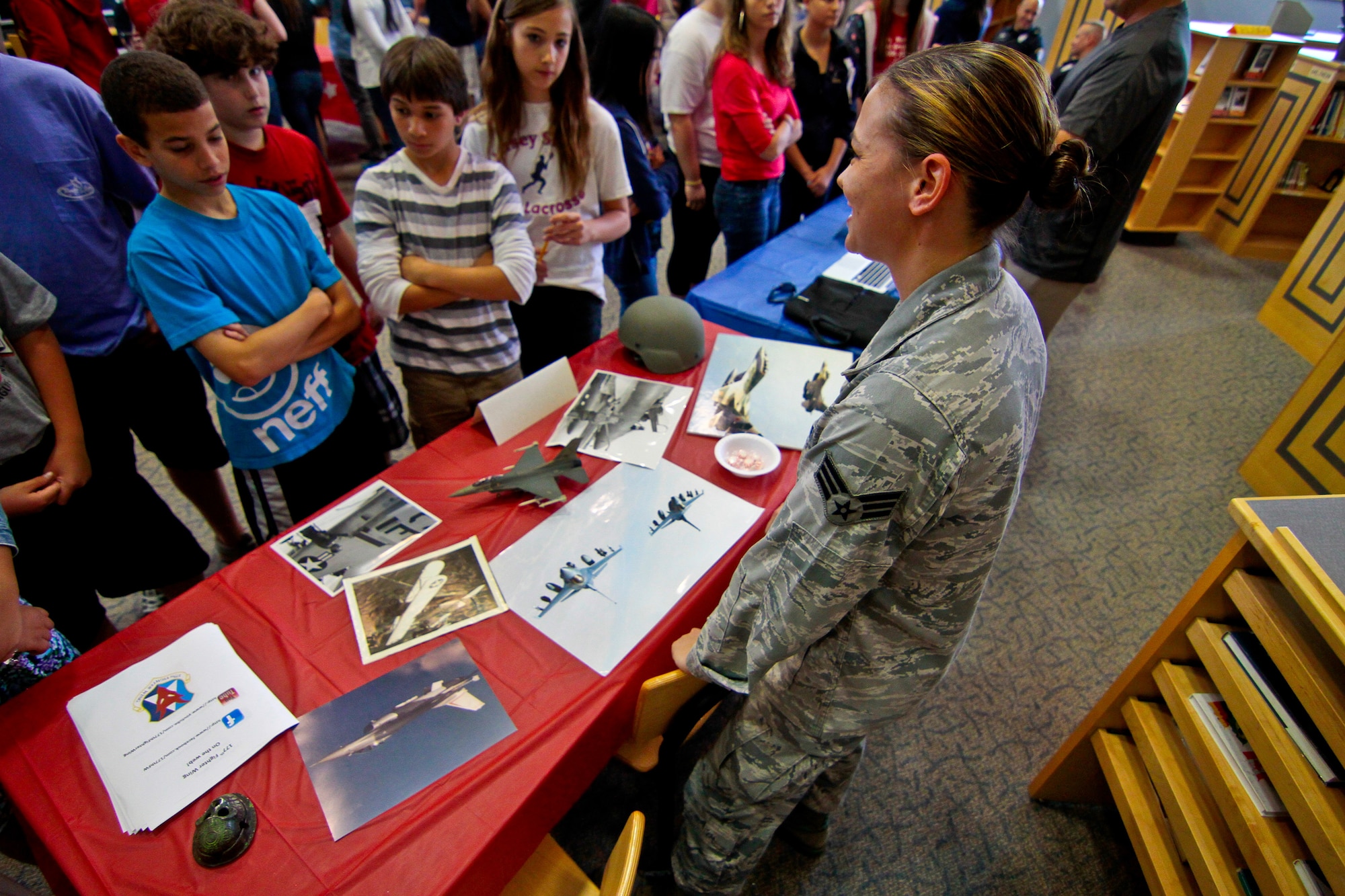 A picture of U.S. Air Force Senior Airman Tina Fryling from the 177th Fighter Wing, New Jersey Air National Guard, discussing her recent deployment to Afghanistan with students at Alder Middle School.