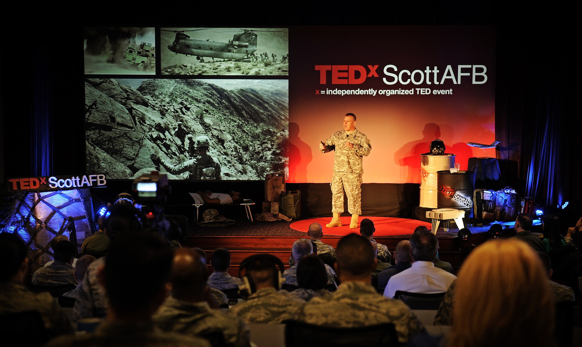 Lt Col. David Preston, special assistant to the commanding general, speaks to an audience at Scott Air Force Base, Ill. May 30, about the austere conditions that military members endure while deployed. Preston served as a logistics officer in Afghanistan overseeing logistics for multiple forward operating bases and their supply requirements. (U.S. Air Force photo/ Staff Sgt. Ryan Crane)