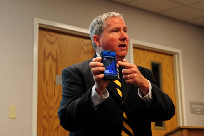 Bill Walsh, on-air chief meteorologist at WCSC-TV Live 5 News and 315th Airlift Wing Chief of Public Affairs, explains how to use one of the many smart phone applications to track the movement of tropical storms or hurricanes at a hurricane preparedness briefing May 23, 2012 at the Airman and Family Readiness Center at Joint Base Charleston, S.C.  Walsh was the guest speaker at the briefing hosted by the Financial Services Office and the Civil Engineer Emergency Management Flight, answering questions about readiness, what to do in the event of a hurricane, as well as the science of a hurricane to JB Charleston military members, Department of Defense employees and dependents.  (U.S. Air Force photo/ Staff Sgt. Nicole Mickle)  