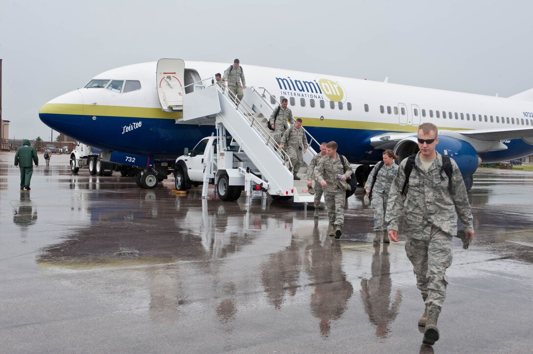 Ellsworth Airmen return to Ellsworth Air Force Base, S.D., following their  participation in Green Flag, an exercise designed to test their ability to survive and operate in a wartime environment, May 24, 2012. B-1 aircrews from the 37th Bomb Squadron and a myriad of support personnel participated in the exercise conducted at Nellis Air Force Base, Nev., the final scrimmage before heading downrange to Southwest Asia later this year. (U.S. Air Force photo by Airman 1st Class Zachary Hada/Released)