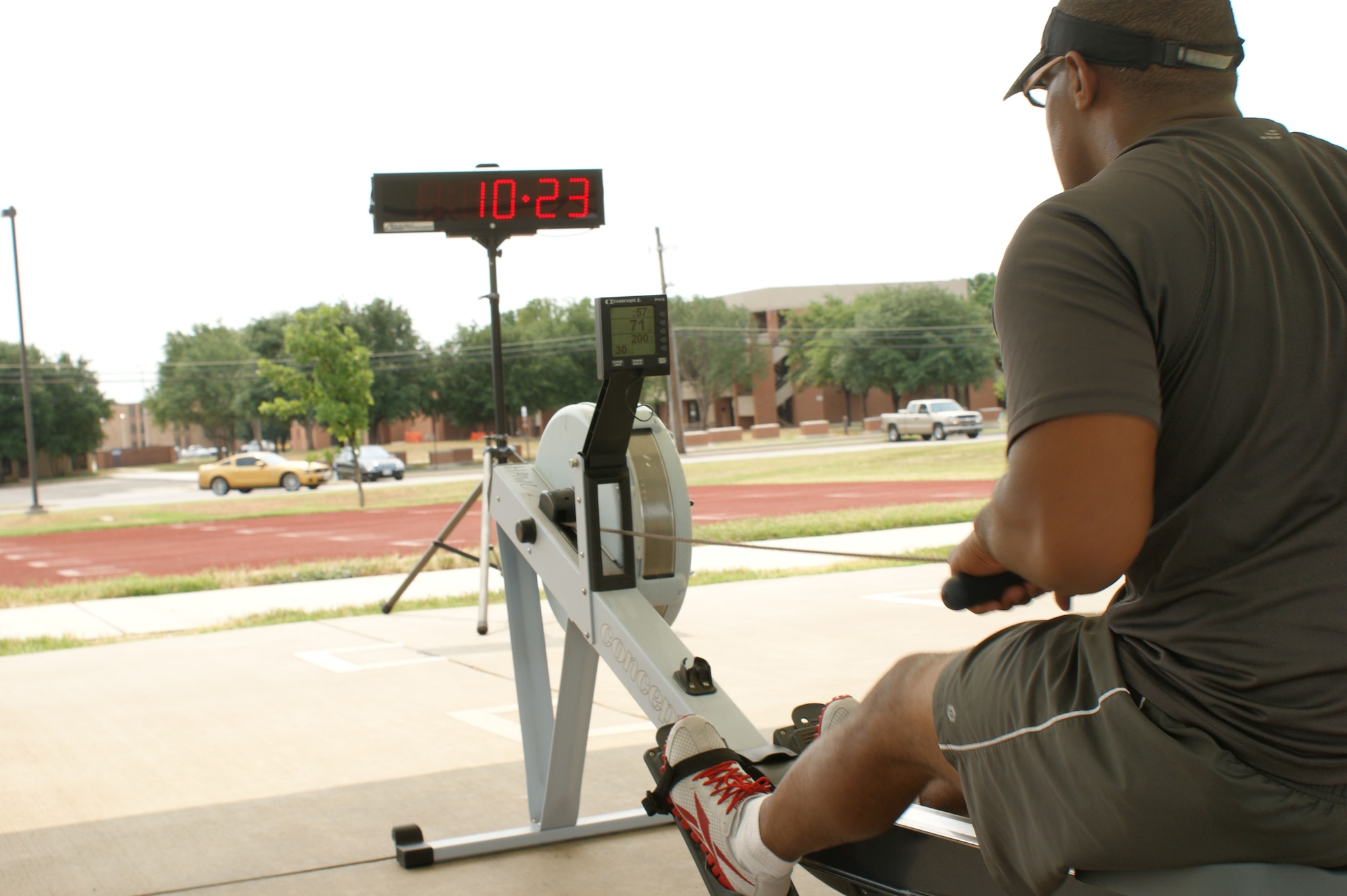 Using a rowing machine is just one of the many workouts used during the "Combat Fit" workout outside the Pitsenbarger Fitness Center May 24, 2012.  "Combat Fit" workouts use varied exercise routines to generate dramatic fitness results. (U.S. Air Force photo/2Lt Jerred Moon)