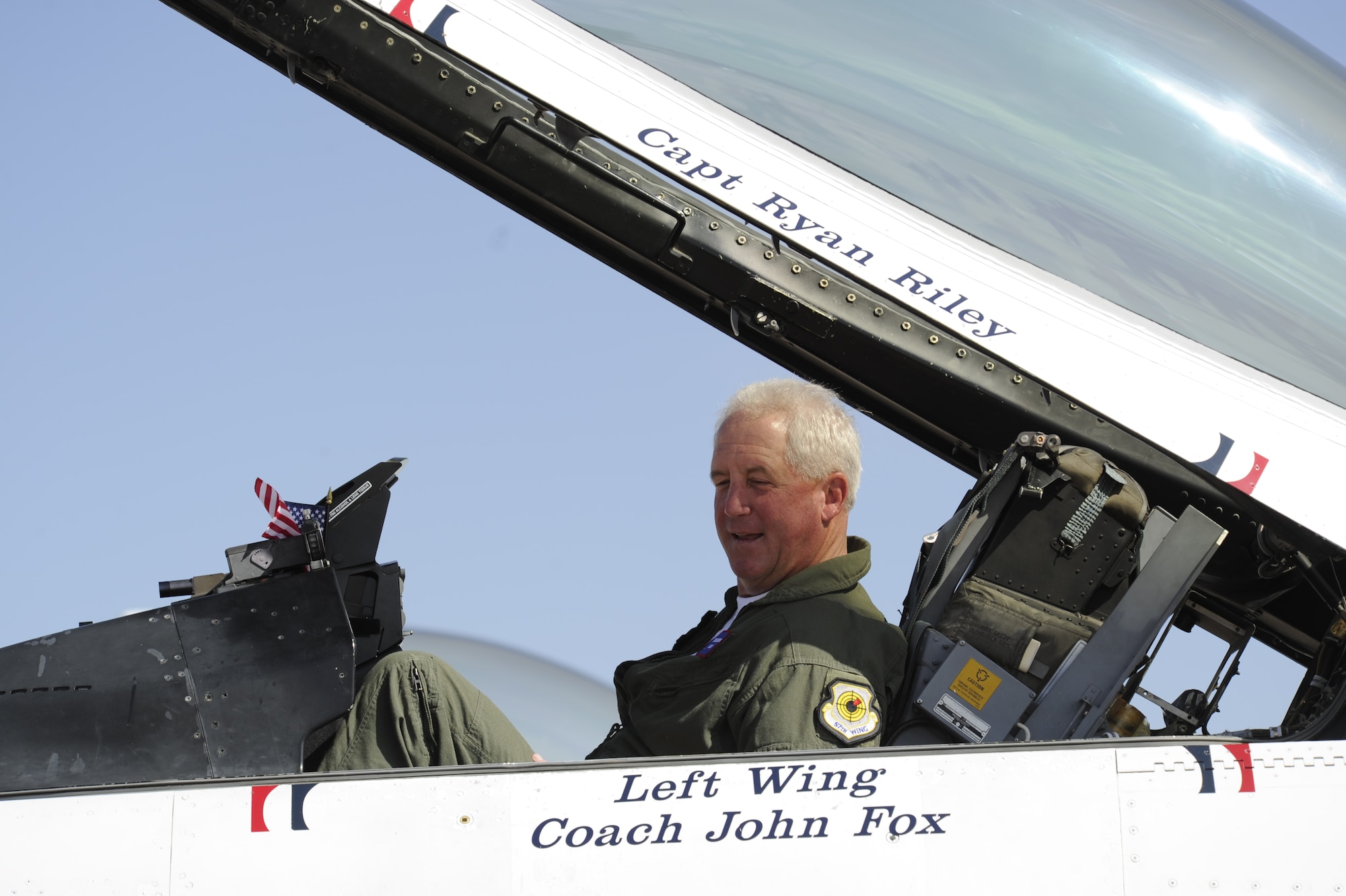 PETERSON AIR FORCE BASE, Colo. -- John Fox, Denver Broncos head football coach, settles into a Thunderbirds F-16 aircraft May 21 at Peterson AFB. The U.S Air Force Air Demonstration Squadron was at Peterson May 21-24 for the U.S. Air Force Academy graduation and selected Fox for an orientation flight. Fox was fitted for a G-suit, received briefings and a flight physical, but the two-seat F-16 aircraft had mechanical difficulties and he was not able to fly with the Thunderbirds. The Thunderbirds, however, offered to give him a flight at a later date. (U.S. Air Force photo/Larry Reid)