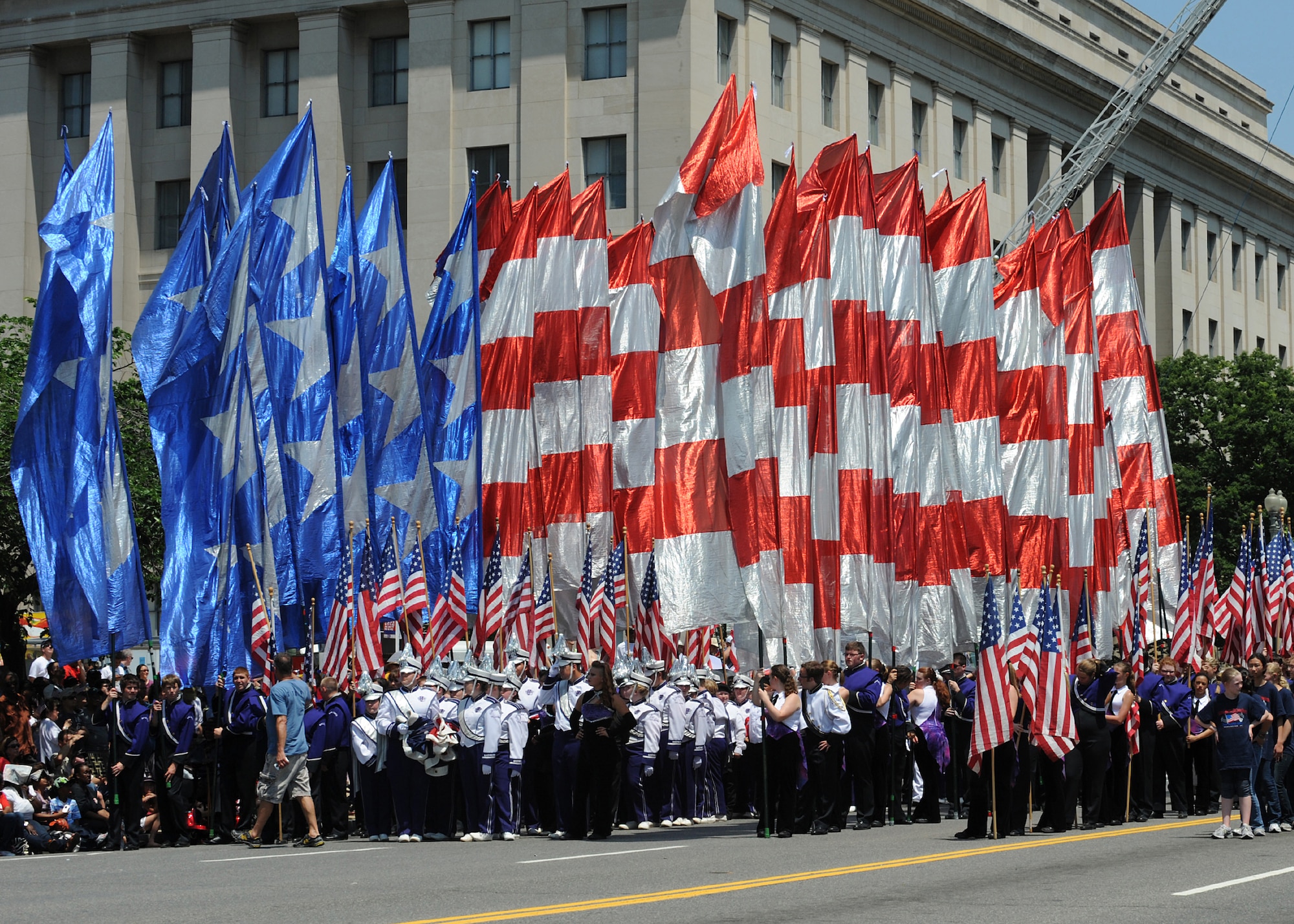 A precession of flags is carried by volunteers at the National Memorial Day Parade on May 28, 2012 in Washington D.C. The annual National Memorial Day Parade is an opportunity for thousands of patriotic Americans to come together and honor those who have sacrificed so much in service to our country.