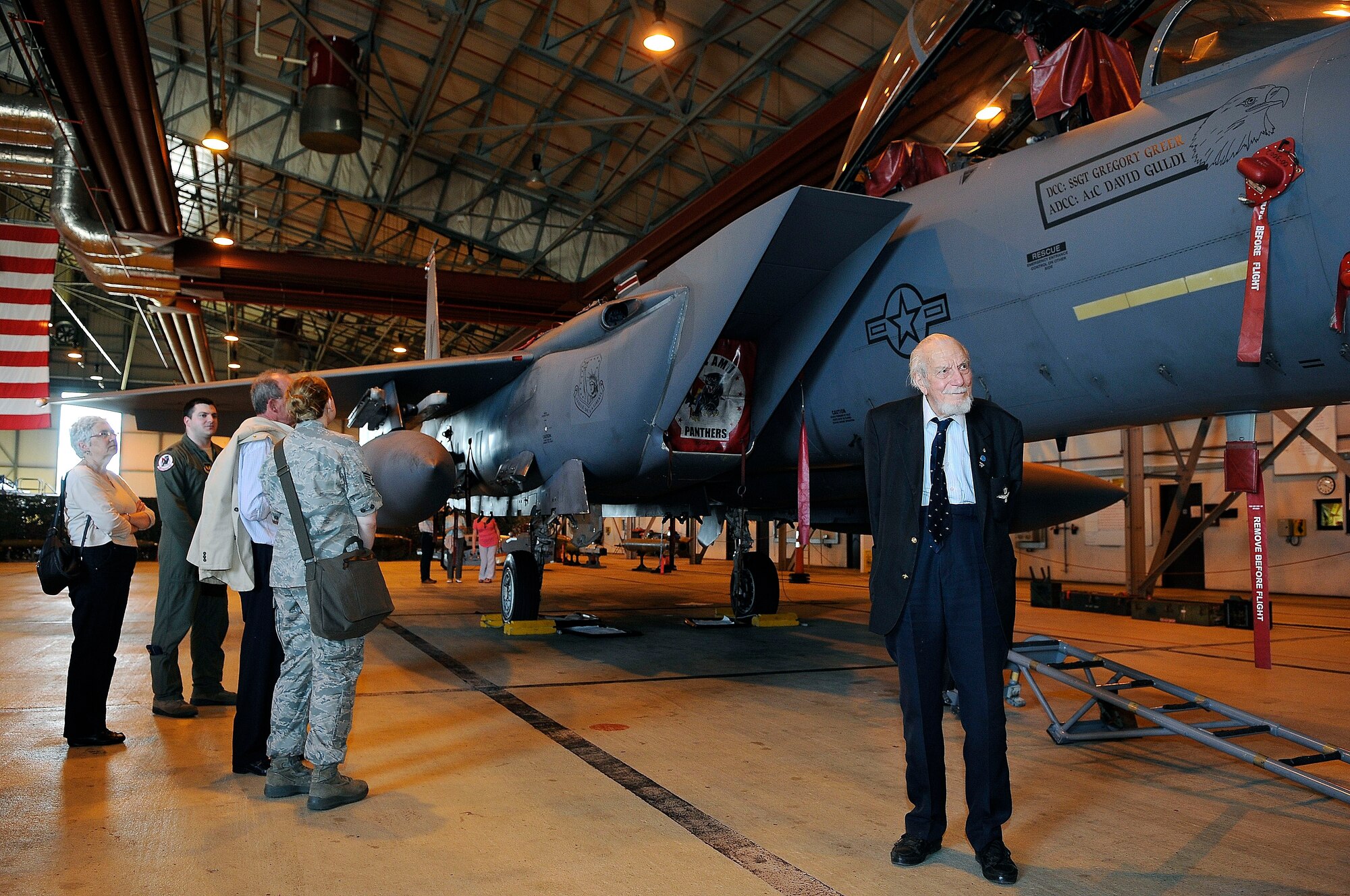 ROYAL AIR FORCE LAKENHEATH, England - Kenneth Wallis, retired RAF wing commander (right), stands in front of an F-15E Strike Eagle during a tour of the base with the RAF Halton Ex Apprentices group May 24, 2012. He is recognized as the oldest pilot to set a world flight record for the fastest climb to 3,000 meters on an autogyro at the age of 81. (U.S. Air Force photo by Staff Sgt. Connor Estes)