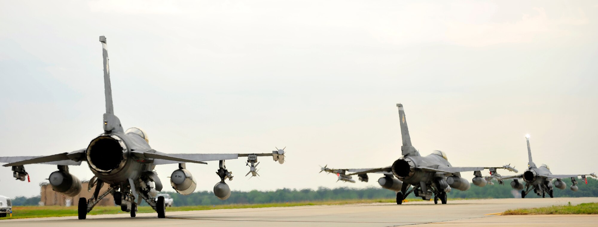 U.S. Air Force F-16 Fighting Falcons assigned to Shaw Air Force Base S.C., perform an elephant walk during an Operational Readiness Exercise, May 22, 2012, Shaw AFB, S.C. An elephant walk occurs when aircraft taxies down the runway in large numbers, which represents the ability to generate a large number of aircraft needing to take off rapidly for a military response. (U.S. Air Force photo by Senior Airman Kenny Holston/Released)


