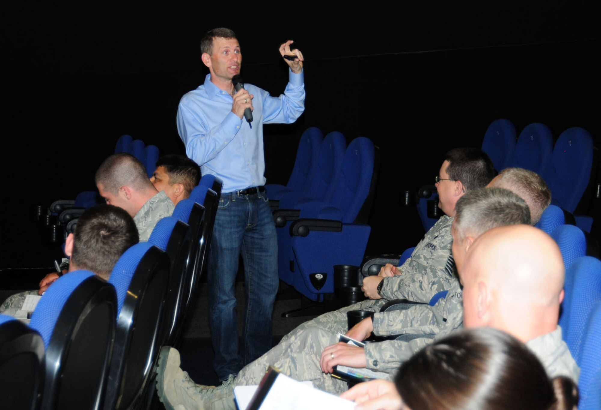 RAF MILDENHALL, England – Jason Womack, a leadership coach and author from California, talks to Team Mildenhall members at the base theater here May 29, 2012. Womack talked about the importance of encouragement, acknowledgement of accomplishment, types of motivation and coaching techniques. He visited RAF Mildenhall to speak as part of the Century Lecture Series, organized by the 100th Operations Group. (U.S. Air Force photo/Karen Abeyasekere)