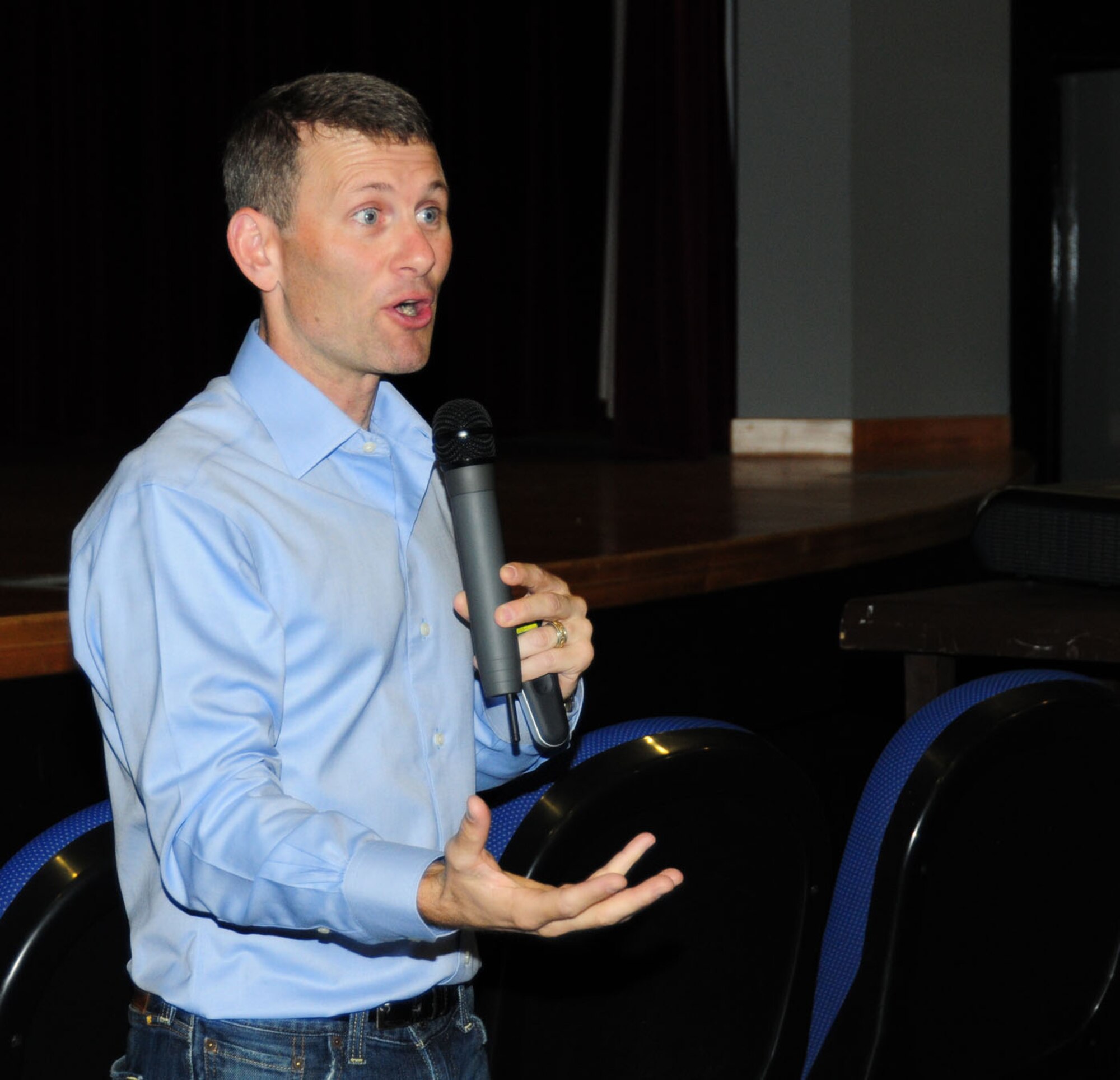 RAF MILDENHALL, England -- Jason Womack, leadership coach, speaks to 100th Air Refueling Wing members May 29, 2012, at the base theater here. Womack, from Ojai, Calif., was here as part of the Century Lecture Series, and spoke to Team Mildenhall members on a variety of topics including types of motivation, coaching techniques, acknowledgement of accomplishment, procrastination, listening and the benefits of networking. (U.S. Air Force photo/Karen Abeyasekere) 
