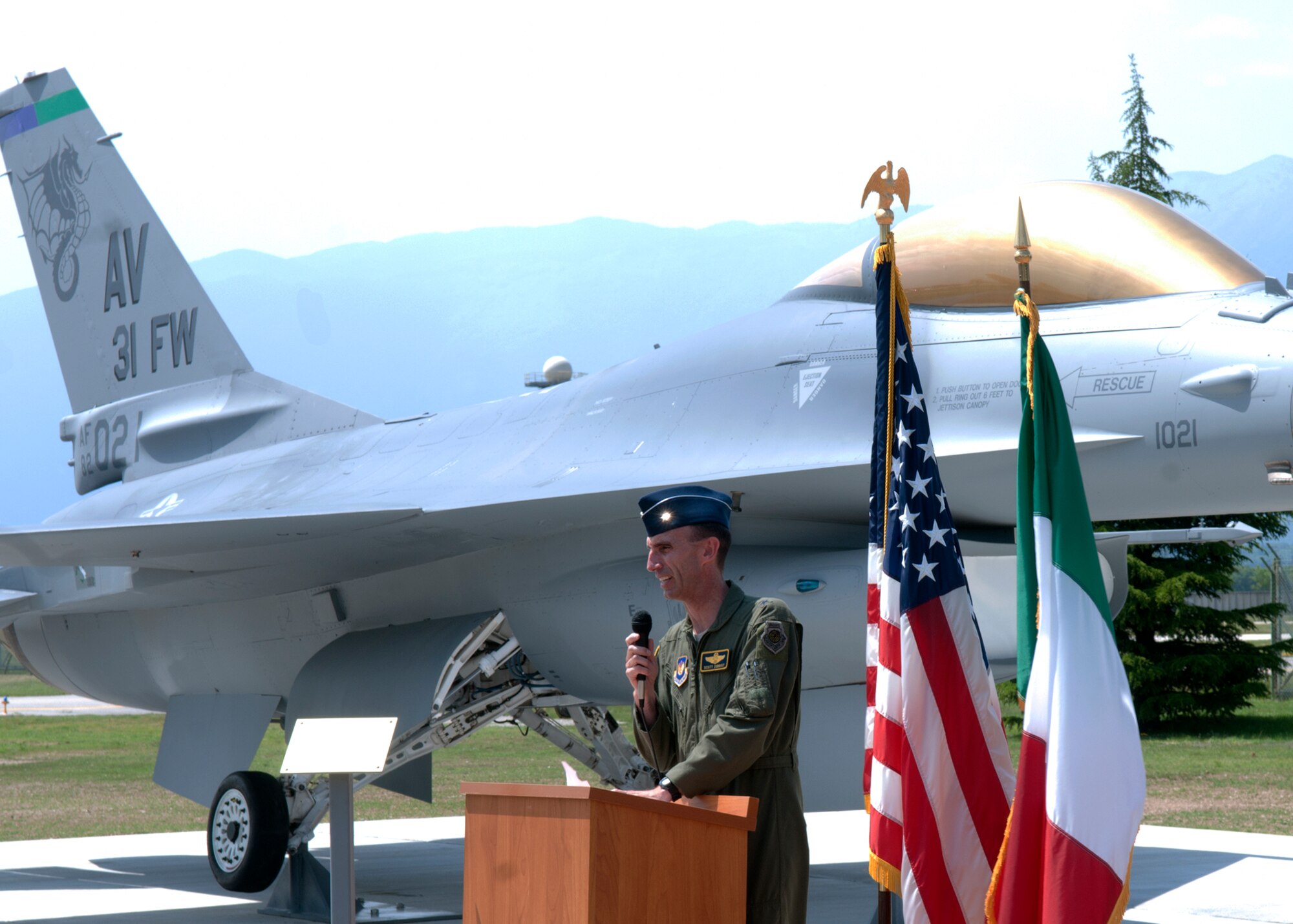 Brig. Gen. Scott Zobrist, 31st Fighter Wing commander, speaks during a new F-16 static display unveiling May 29 at Aviano Air Base, Italy. The decomissioning of the Fighting Falcon took approximately 4,125 hours and included sanding, painting, egress seat and gun removal. (U.S. Air Force photo/Airman 1st Class Briana Jones)