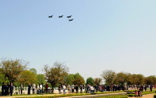 MADINGLEY, England – A formation of F-15C Eagles from the 48th Fighter Wing, fly over Cambridge American Cemetery during the 68th Annual Memorial Day Observance May 28, 2012, at the cemetery. An MC-130H Combat Talon from the 352nd Special Operations Group and a KC-135 Stratotanker from the 100th Air Refueling Wing also performed fly-bys during the ceremony. (U.S. Air Force photo/Senior Airman Rachel Waller)