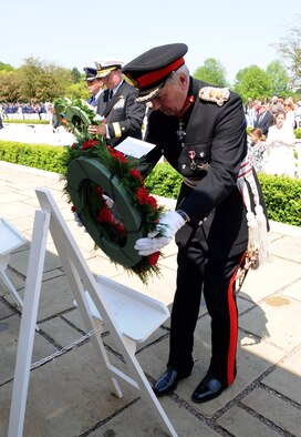 MADINGLEY, England – Hugh Duberly, Her Majesty’s Lord-Lieutenant of Cambridgeshire, lays a wreath on behalf of the United Kingdom at the Wall of the Missing during the 68th Annual Memorial Day Observance May 28, 2012, at Cambridge American Cemetery. The Wall of the Missing contains more than 5,000 names of Service members missing in action, lost or buried at sea, or unknown. (U.S. Air Force photo/Senior Airman Rachel Waller)