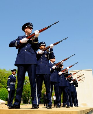 MADINGLEY, England – The RAF Mildenhall Honor Guard performs a three-volley salute during the Madingley American Cemetery Memorial Service in Cambridge May 28, 2012. The salute is also performed at military funerals and originates from the European dynastic wars when the battle was ceased so the dead and wounded could be removed, and three shots were fired to signal that battle could resume. (U.S. Air Force photo/Senior Airman Ethan Morgan)