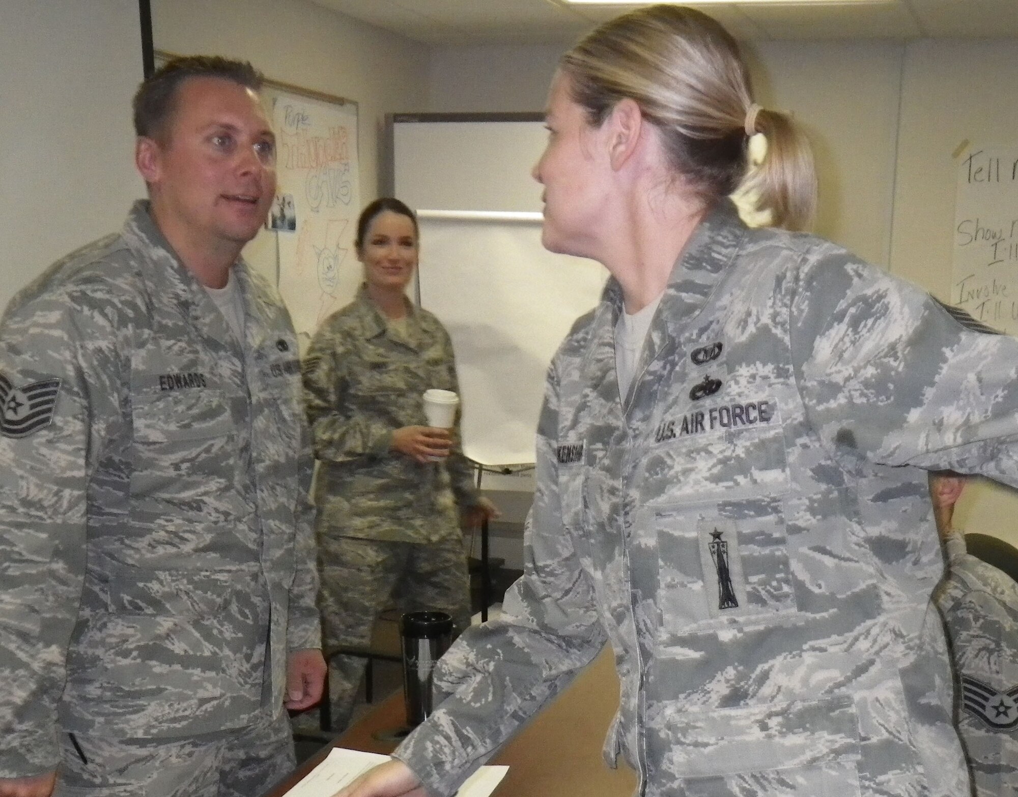 Facilitator Staff Sgt. Bree Davis (rear) observes participants in the Air Force Reserve Command's NCO Leadership Development Program in April at Dover Air Force Base. Davis is a 512th Airlift Wing reservist.