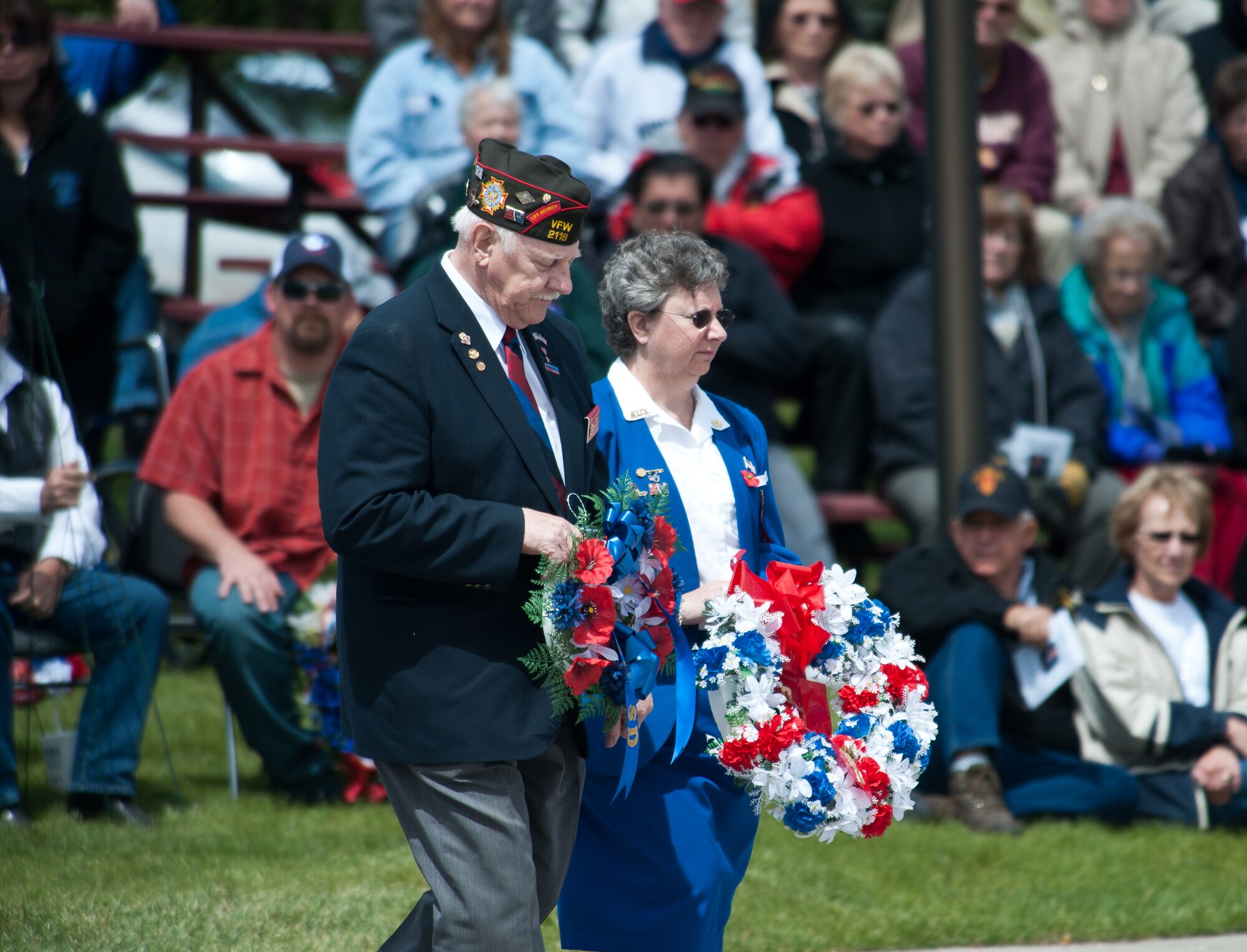 Verne Hansen, State Veterans of Foreign Wars Commander of South Dakota, and his wife place wreaths during a ceremony as part of a Memorial Day Program at Black Hills National Cemetery, S.D., May 28, 2012. Roughly 300 people gathered at the cemetery while 24 wreaths were laid to memorialize U.S. service members who made the ultimate sacrifice for their country. (U.S. Air Force photo by Airman 1st Class Alystria Maurer/Released)
