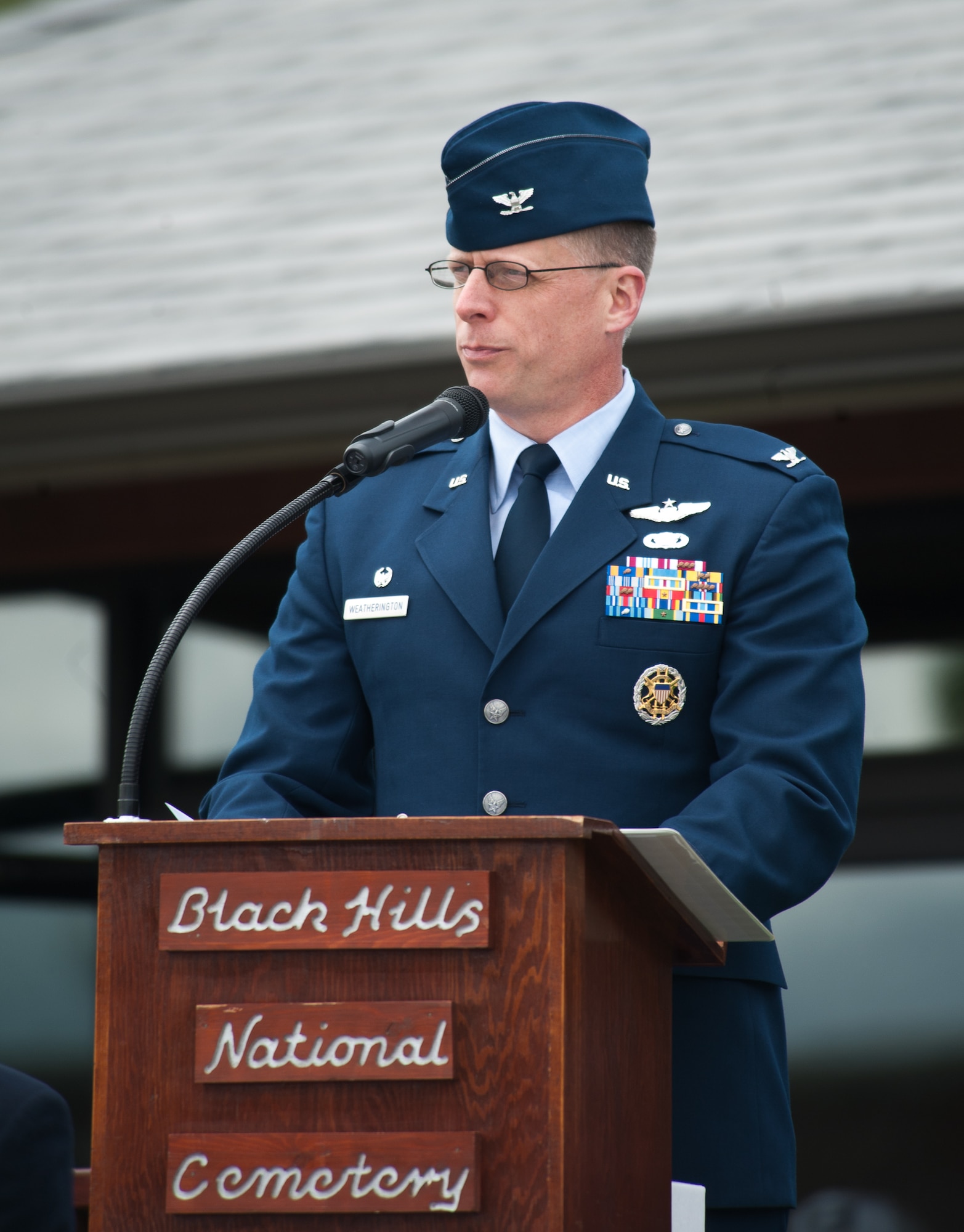 Col. Mark Weatherington, 28th Bomb Wing commander, speaks of the sacrifices made both by veterans and men and women serving today during a Memorial Day Program at Black Hills National Cemetery, S.D., May 28, 2012. Weatherington also recognized the families of those fallen, and honored their sacrifices. (U.S. Air Force photo by Airman 1st Class Alystria Maurer/Released)