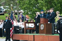 Attendees of the Memorial Day Program salute the Sturgis Volunteer Honor Guard during posting of the colors at the Black Hills National Cemetery, S.D., May 28, 2012. Black Hills National Cemetery held two ceremonies paying homage to all those who answered the nations call, and made the ultimate sacrifice in defense of our Nation. (U.S. Air Force photo by Airman 1st Class Alystria Maurer/Released)