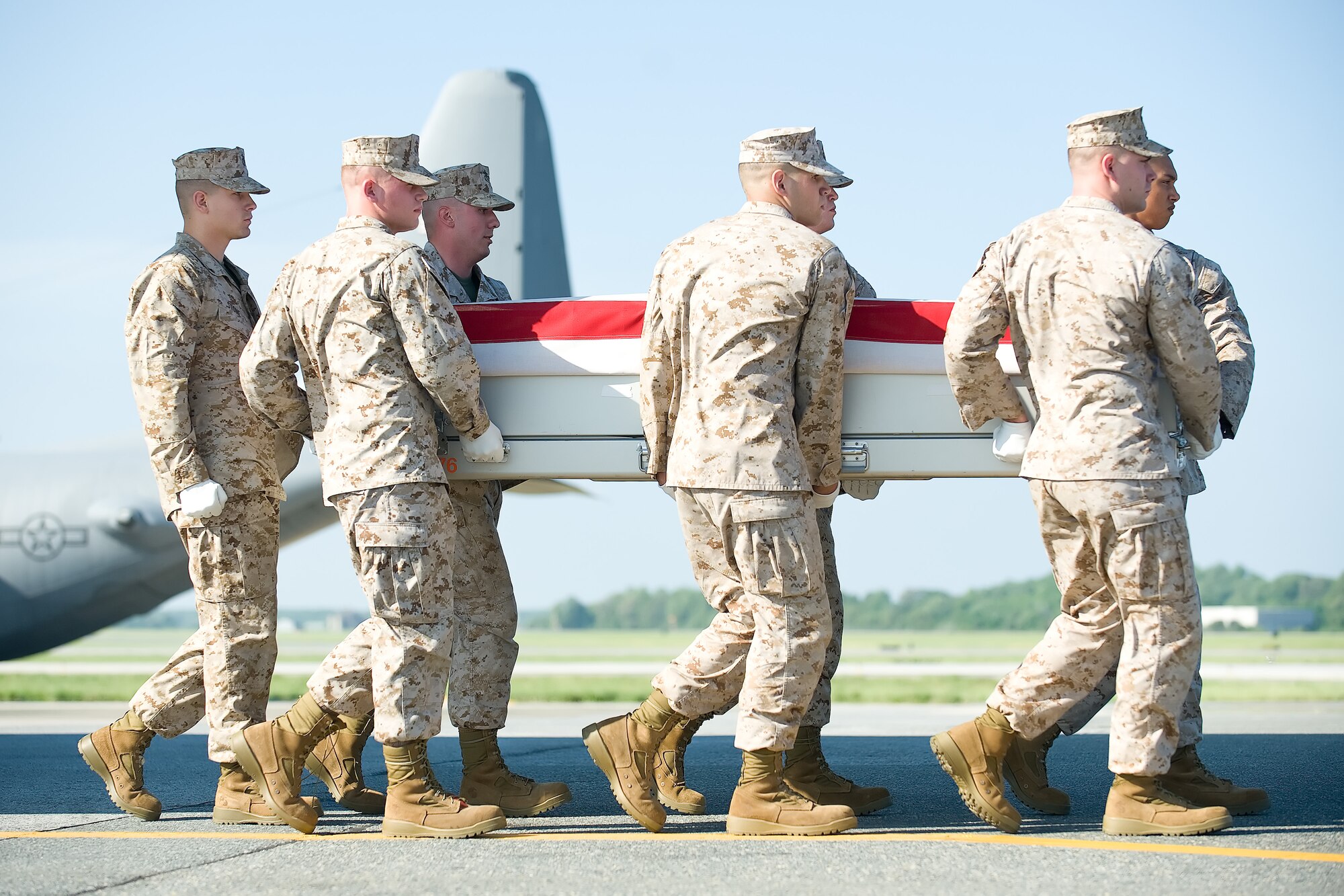 A U.S. Marine Corps carry team transfers the remains of Marine Lance Cpl. Steven G. Sutton of Leesburg, Ga., at Dover Air Force Base, Del., May 29, 2012. Sutton was assigned to 1st Battalion, 8th Marine Regiment, 2nd Marine Division, II Marine Expeditionary Force, Camp Lejeune, N.C. (U.S. Air Force photo/Adrian R. Rowan)
