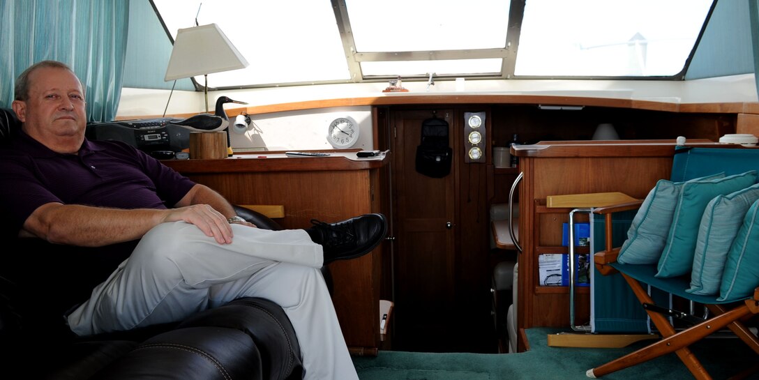 Richard Watson, a Navy Special Emphasis Operations Atlantic team leader with the Defense Contract Management Agency, shows off the interior of his boat, the Delta Lady, May 29, 2012, at Langley Air Force base, Va. Watson owns a home in Florida, but, due to his job, lives on his boat at the Langley Marina. (U.S. Air Force photo by Airman 1st Class Austin Harvill/Released)
