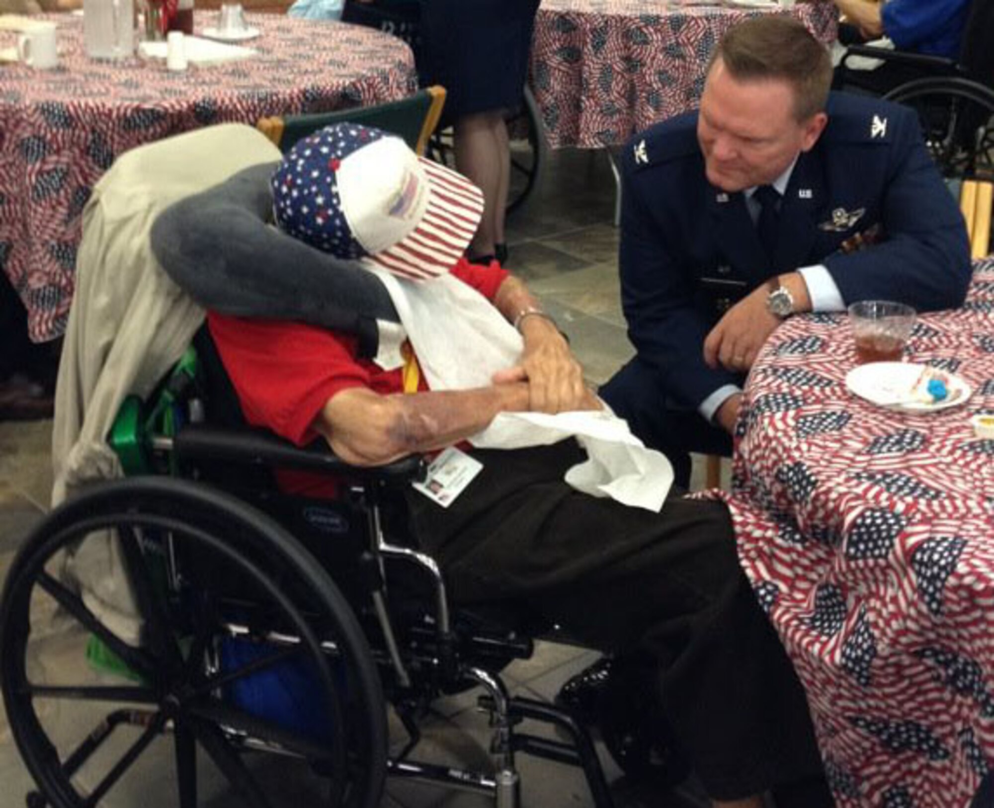 Col. Samuel Mahaney, 459th Air Refueling Wing commander, talks with a 92-year-old doctor during a visit to the Charlotte Hall Veterans Home, Md.,  for a Memorial Day event and luncheon, May 30, 2012. The doctor has delivered over 3,000 babies and was in charge of 100 corpsmen during World War II.  (Photo by/Christine Mahaney)