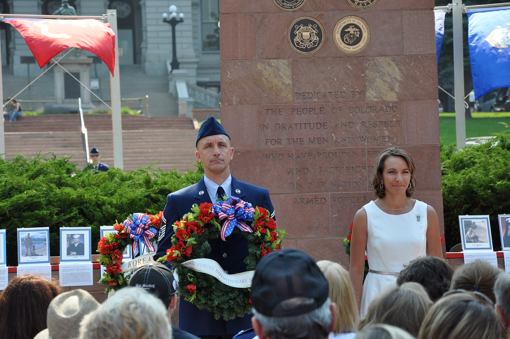 Senior Master Sgt. Jimmie Morris assists Army Captain Elizabeth Meyer in the placement of the Armed Forces Expeditionary Service wreath during the Colorado Veterans Memorial Day Tribute May 26, 2012.  (Courtesy photo by Esmerlinda Morris)