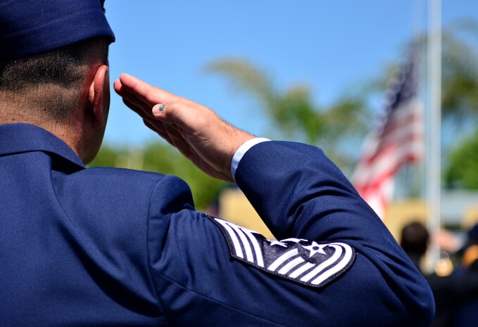 Chief Master Sgt. Robert White, 9th Reconnaissance Wing command chief, salutes the American Flag during a Memorial Day ceremony at the Calvary Christian Center, Yuba City, Calif., May 28, 2012. White is one of many Airmen from Beale to attend the closing ceremony for fallen warriors. (U.S. Air Force photo by Airman1st Class Ayla Quellhorst/Released)