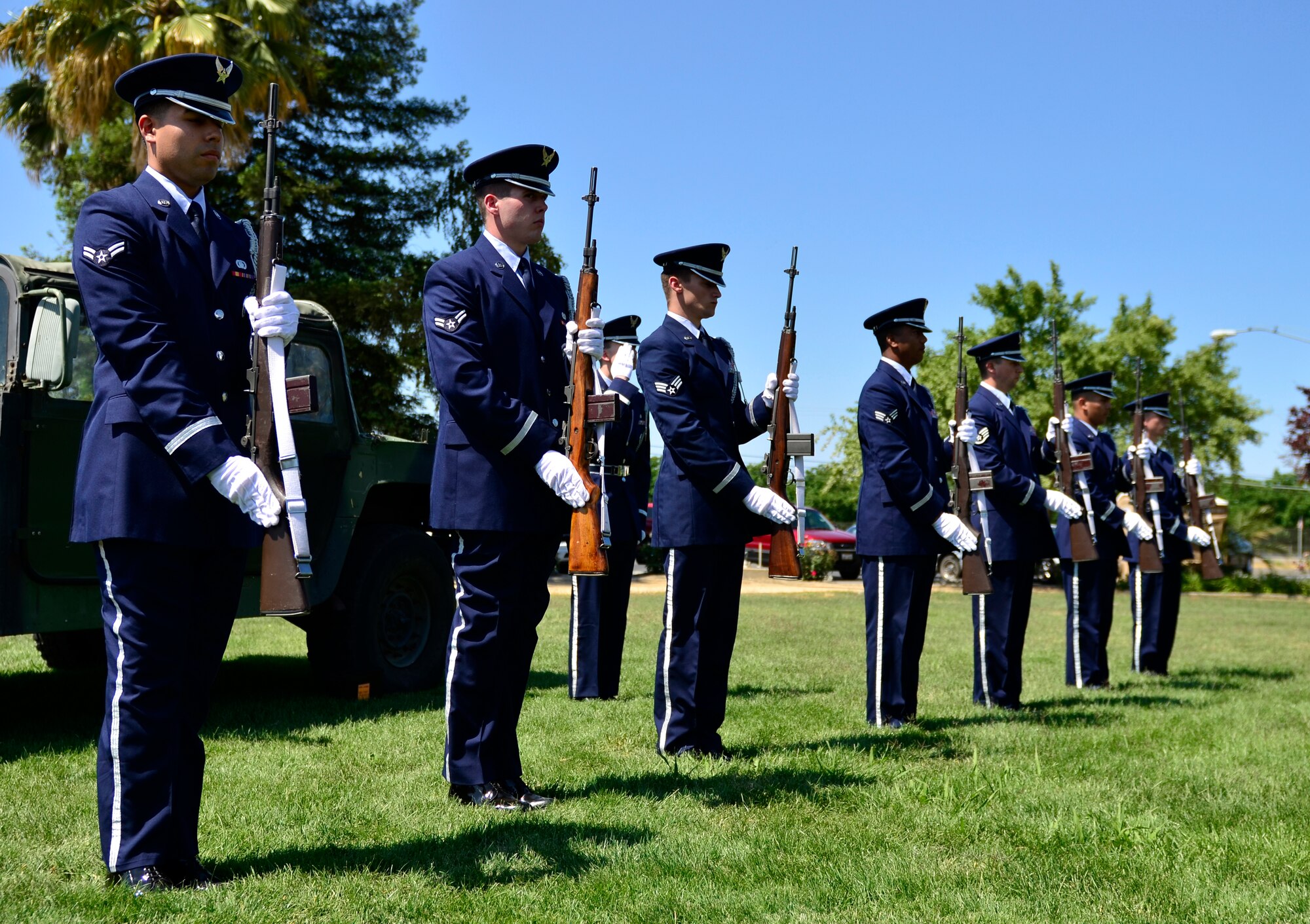 Airmen from the Beale Base Honor Guard present arms during a Memorial Day ceremony at the Calvary Christian Center, Yuba City, Calif., May 28, 2012. The firing party was part of the closing ceremonies to honor fallen warriors. (U.S. Air Force photo by Airman1st Class Ayla Quellhorst/Released)