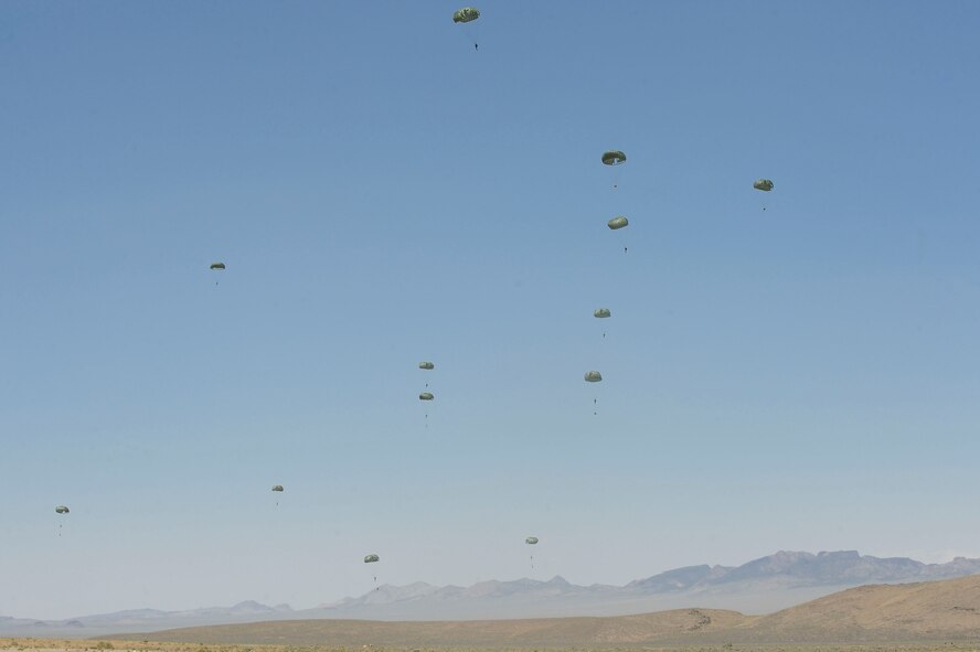 Airmen and Soldiers land at the Nevada Test and Training Range for Mobility Forces Exercise 12A in Tonopah, Nev., May 23, 2012. The exercise included delivery of approximately 100 paratroopers from Nellis Air Force Base, Nev., Fort Bragg, N.C., and Airmen from the 18th Air Support Operations Group. (U.S. Air Force photo by Staff Sgt. Ciara Wymbs/Released)