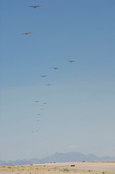 C-130s fly over the Nevada Test Training Range during Mobility Forces Exercise 12A in Tonopah, Nev., May 23, 2012. The exercise is part of the six-month Weapons Instructor Course held at the Weapons School located at Nellis Air Force Base, Nev. (U.S. Air Force photo by Staff Sgt. Ciara Wymbs/Released) 