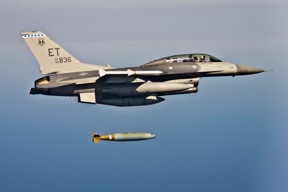 Squadron Leader Sion Hughes, a British exchange pilot, and Capt. Gary Beisner, a 46th Operations Group test engineer, release an inert Mark-84 bomb during a bomb rack unit jettison test May 21.  The mission collected separations data for the BRU-61carriage system loaded with a Guided Bomb Unit-39 over the Gulf of Mexico.  The F-16 Fighting Falcon is the first DoD aircraft to test jettison capabilities of the BRU-61.  (U.S. Air Force photo/Staff Sgt. Joely Santiago)