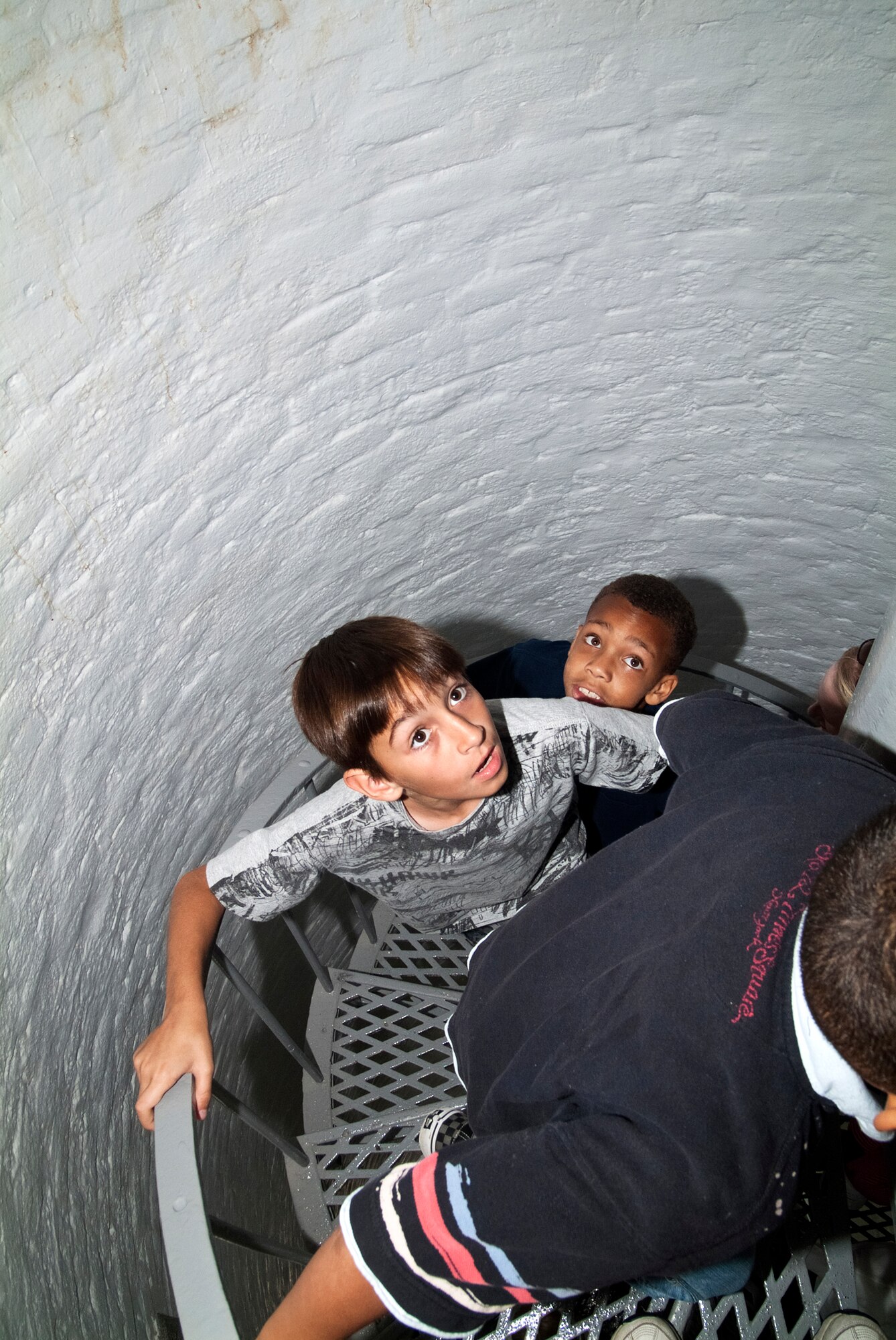 Chandler Belford, son of Brad Belford, 81st Medical Group, Keesler Air Force Base, Miss., and Michelle Belford, child development center; and Julian August, son of 1st Lt. Teena and Jonathan August, 81st Inpatient Operations Squadron, climb the spiral stairs in the Biloxi Lighthouse during a Keesler Youth Center tour May 25, 2012.  (U.S. Air Force photo by Herb Welch)