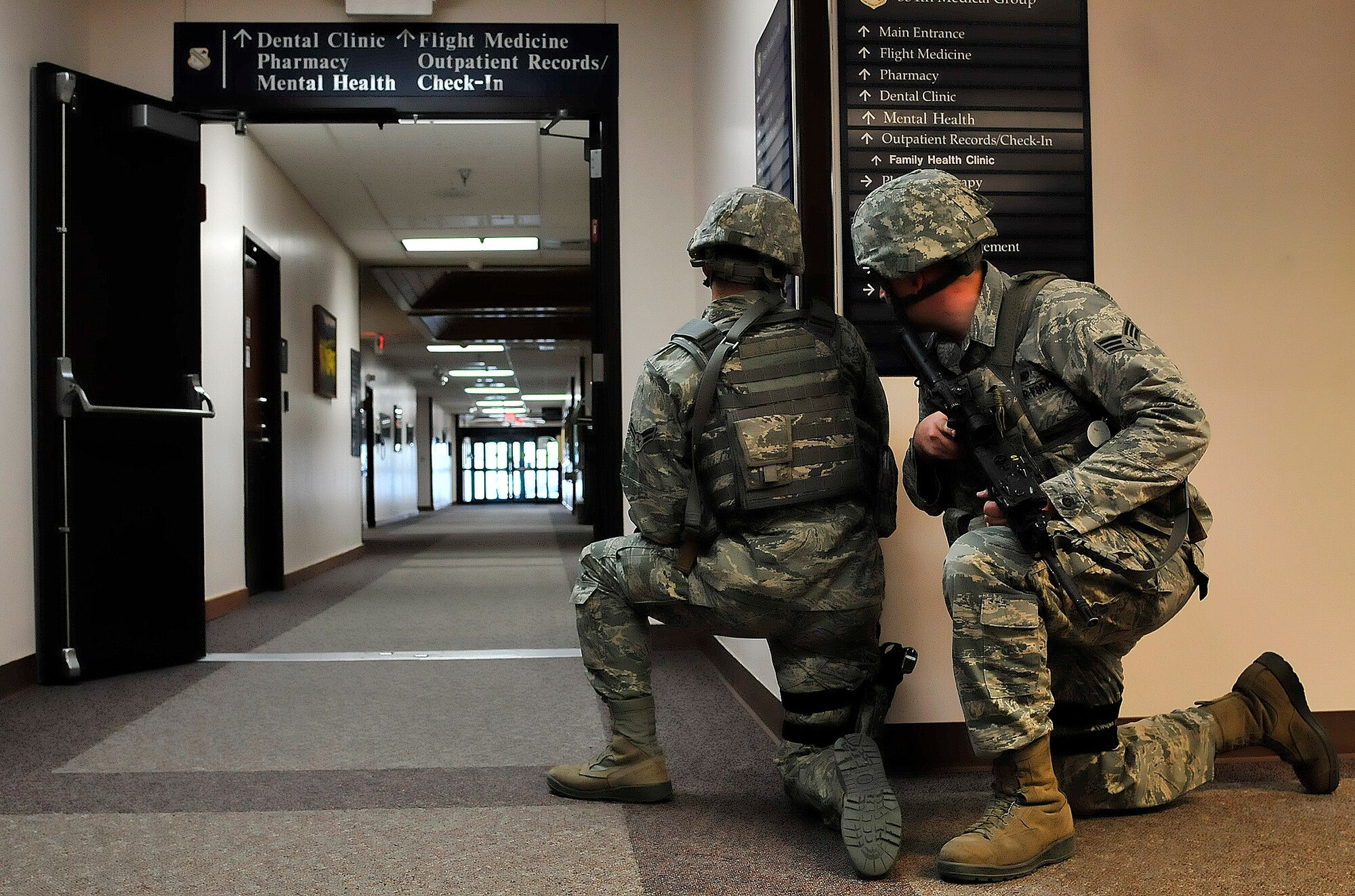 U.S. Air Force Airmen with the 354th Security Force Squadron perform room-clearing procedures during an active shooter exercise May 23, 2012, at the 354th Medical Group, Eielson Air Force Base, Alaska. 354th SFS Airmen learn these skills in order to quickly neutralize a threat should a real-life situation take place. (U.S. Air Force photo/Airman 1st Class Zachary Perras)