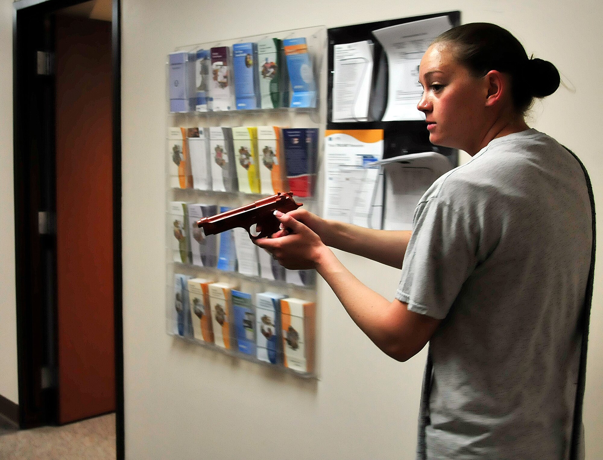 U.S. Air Force Staff Sgt. Jennifer Carr, 354th Security Forces Squadron police services, portrays an active shooter during an exercise May 23, 2012, at the 354th Medical Group, Eielson Air Force Base, Alaska. The exercise filled a mental health clinic requirement to ensure medical personnel know how to handle a duress situation. (U.S. Air Force photo/Airman 1st Class Zachary Perras)