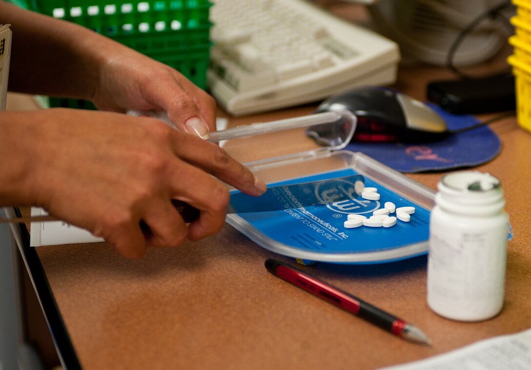 Theresa Wright, 28th Medical Support Squadron pharmacy technician, counts pills to correctly fill a prescription on Ellsworth Air Force Base, S.D., May 22, 2012. The 28th MSS completes an average of 510 prescriptions a day. (U.S. Air Force photo by Airman 1st Class Alystria Maurer/Released)