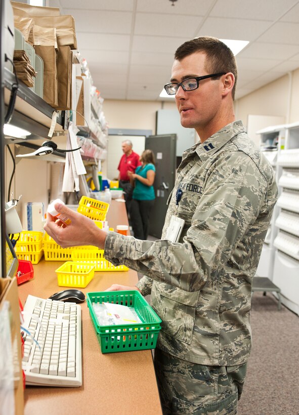 Capt. Richard Boyd, 28th Medical Support Squadron pharmacist, verifies prescriptions during quality control checks on Ellsworth Air Force Base, S.D., May 22, 2012. The checks are vital to ensuring patients receive the proper prescriptions. (U.S. Air Force photo by Airman 1st Class Alystria Maurer/Released)