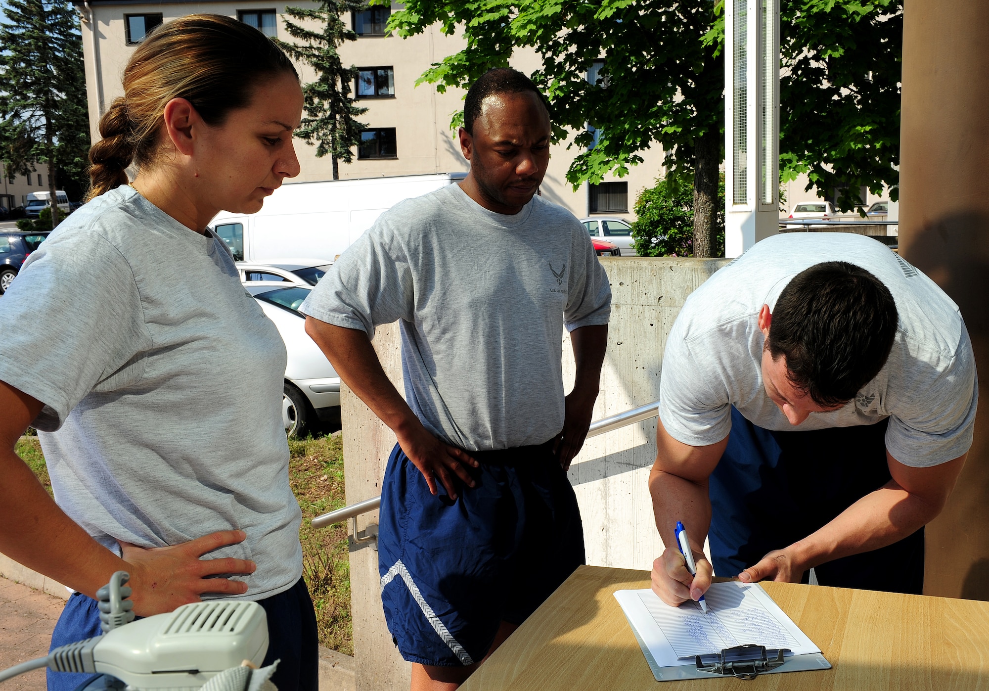 Members of the 86th Comptroller Squadron sign in for the 24-hour Prisoner of War and Missing in Action Memorial Run at Ramstein Air Base, Germany, May 25, 2012. The 24-hour POW-MIA Memorial Run was held to remember our fallen and missing U.S. warriors and comrades.  (U.S. Air Force photo/Airman First Class Holly Cook)