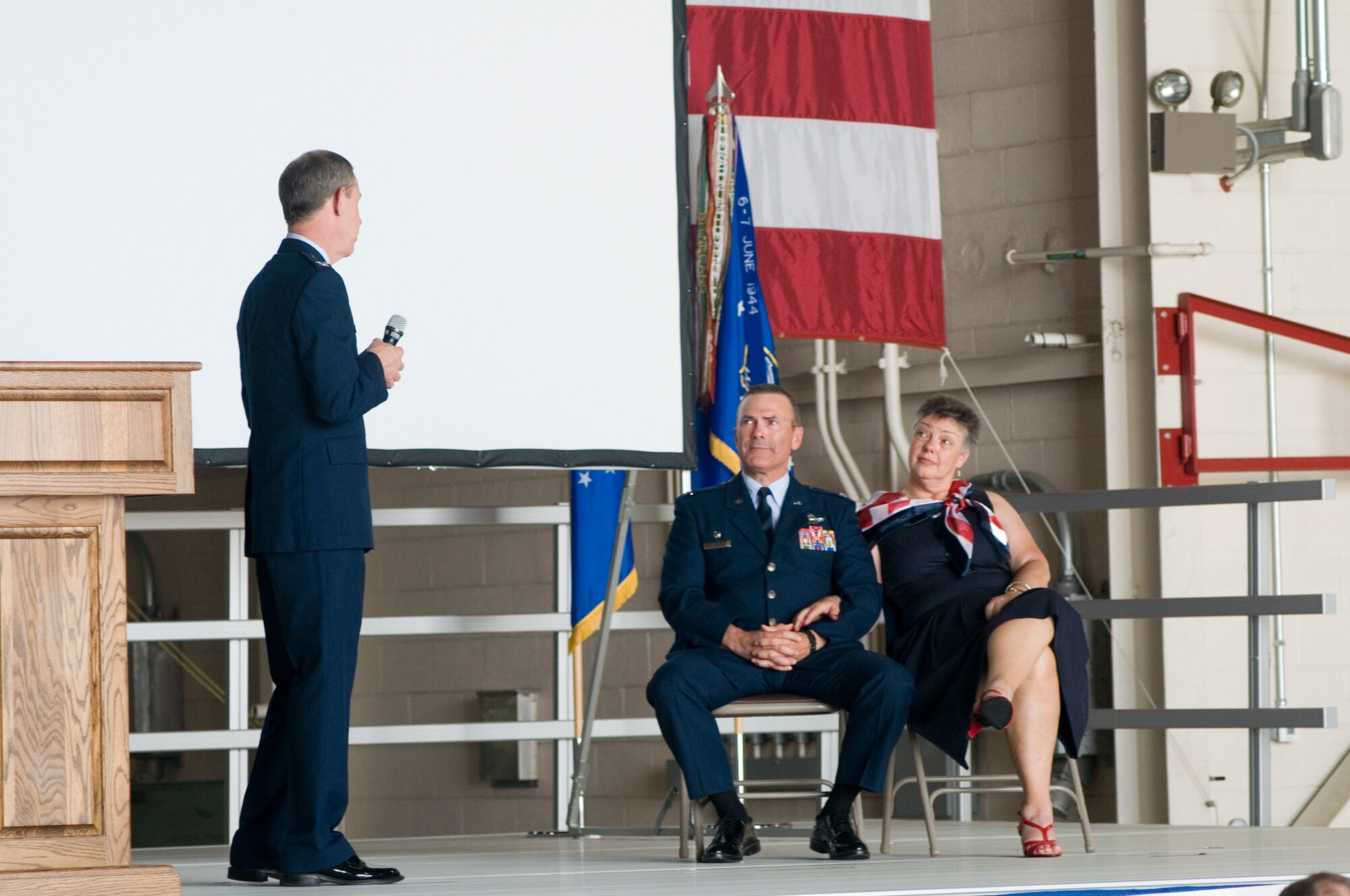 GRISSOM AIR RESERVE BASE, Ind. -- Col. William T. "Tim" Cahoon, 434th Air Refueling Wing commander, and his wife Vicki listen to retired Col. Ronald Farris speak during Cahoon's retirement ceremony May 20 at Grissom. Cahoon retired after nearly 35 years of service in the Air Force. (U.S. Air Force photo/Senior Airman Andrew McLaughlin)