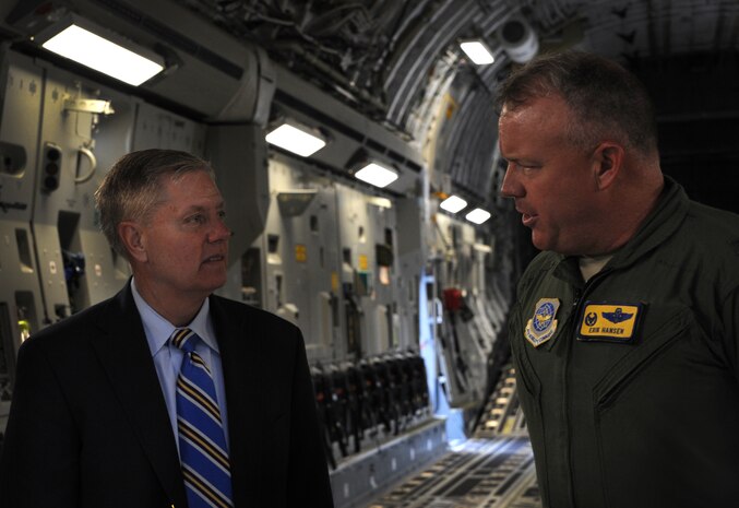 Colonel Erik Hansen, 437th Airlift Wing commander, speaks with U.S. Sen. Lindsey Graham from South Carolina aboard a C-17 Globemaster III upon his arrival May 29, 2012 to JB Charleston, S.C. Graham visited the base to have an open forum with JB Charleston leadership. (U.S. Air Force photo/Airman 1st Class Ashlee Galloway)