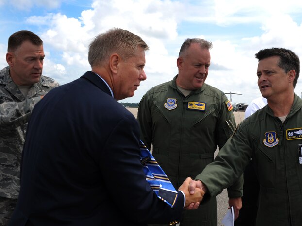 Colonel Russell Fingar (right), 315th Airlift Wing commander, Col. Erik Hansen (center), 437th Airlift Wing commander, and Col. Richard McComb (left), Joint Base Charleston commander, greet U.S. Sen. Lindsey Graham from South Carolina upon his arrival May 29, 2012 to JB Charleston, S.C. Graham visited the base to have an open forum with JB Charleston leadership. (U.S. Air Force photo/Airman 1st Class Ashlee Galloway)